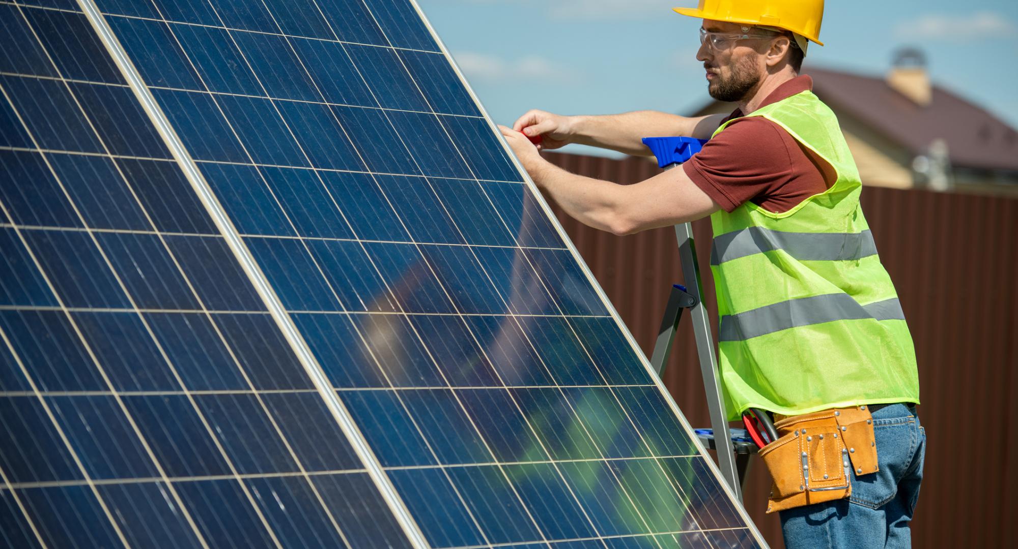 Engineer installing solar panels