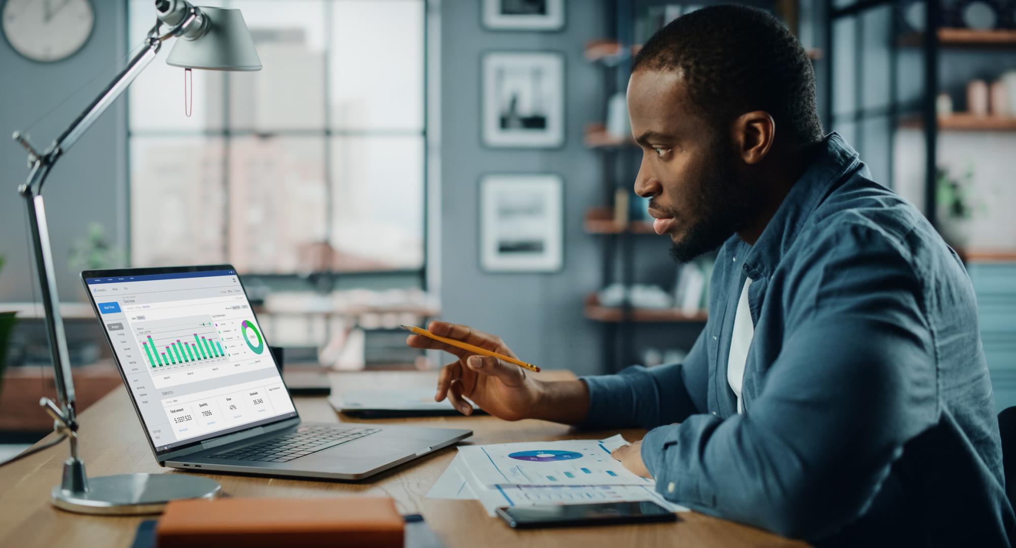 Man at a computer analysing data