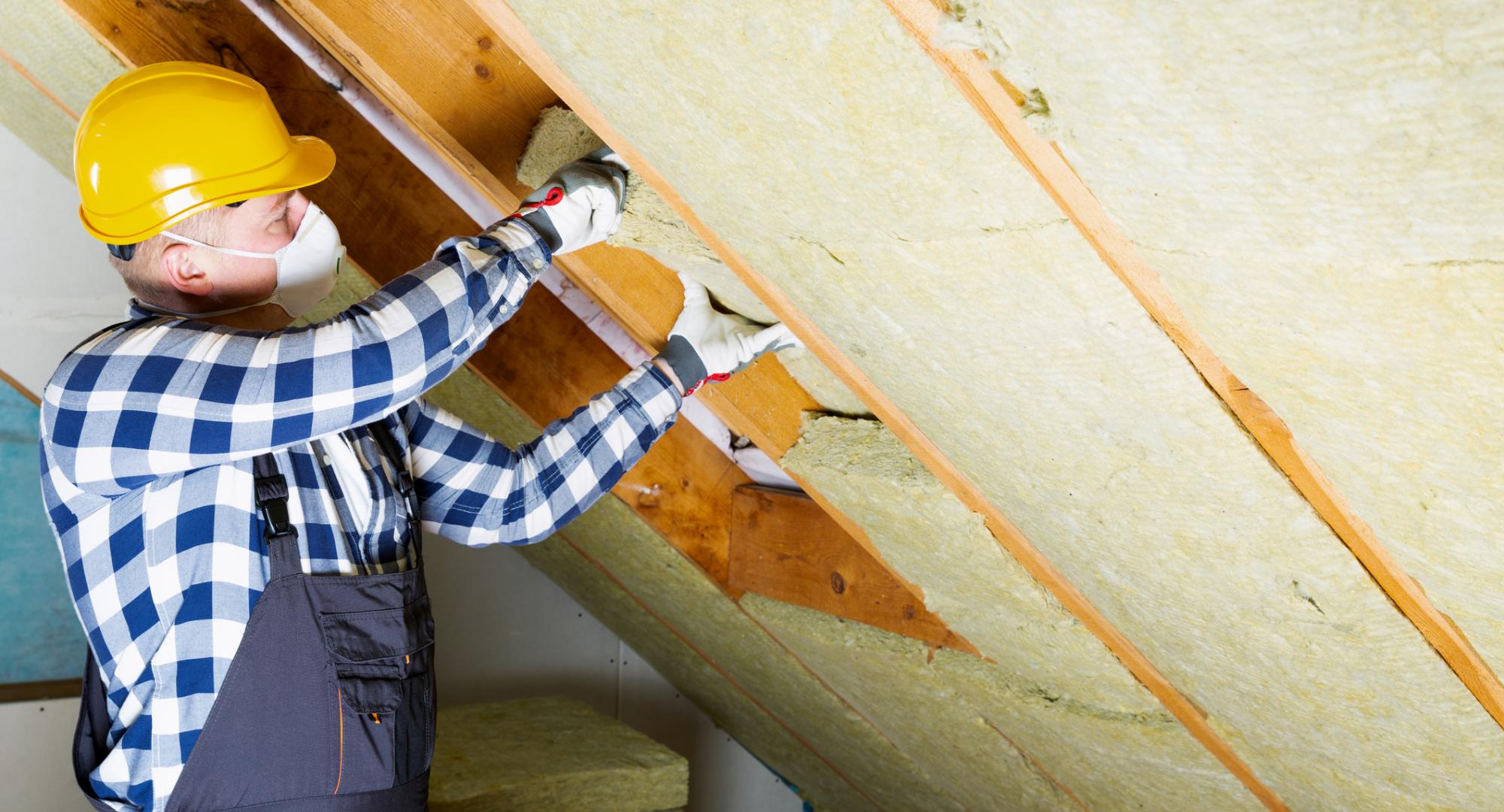 Man installing roof insulation