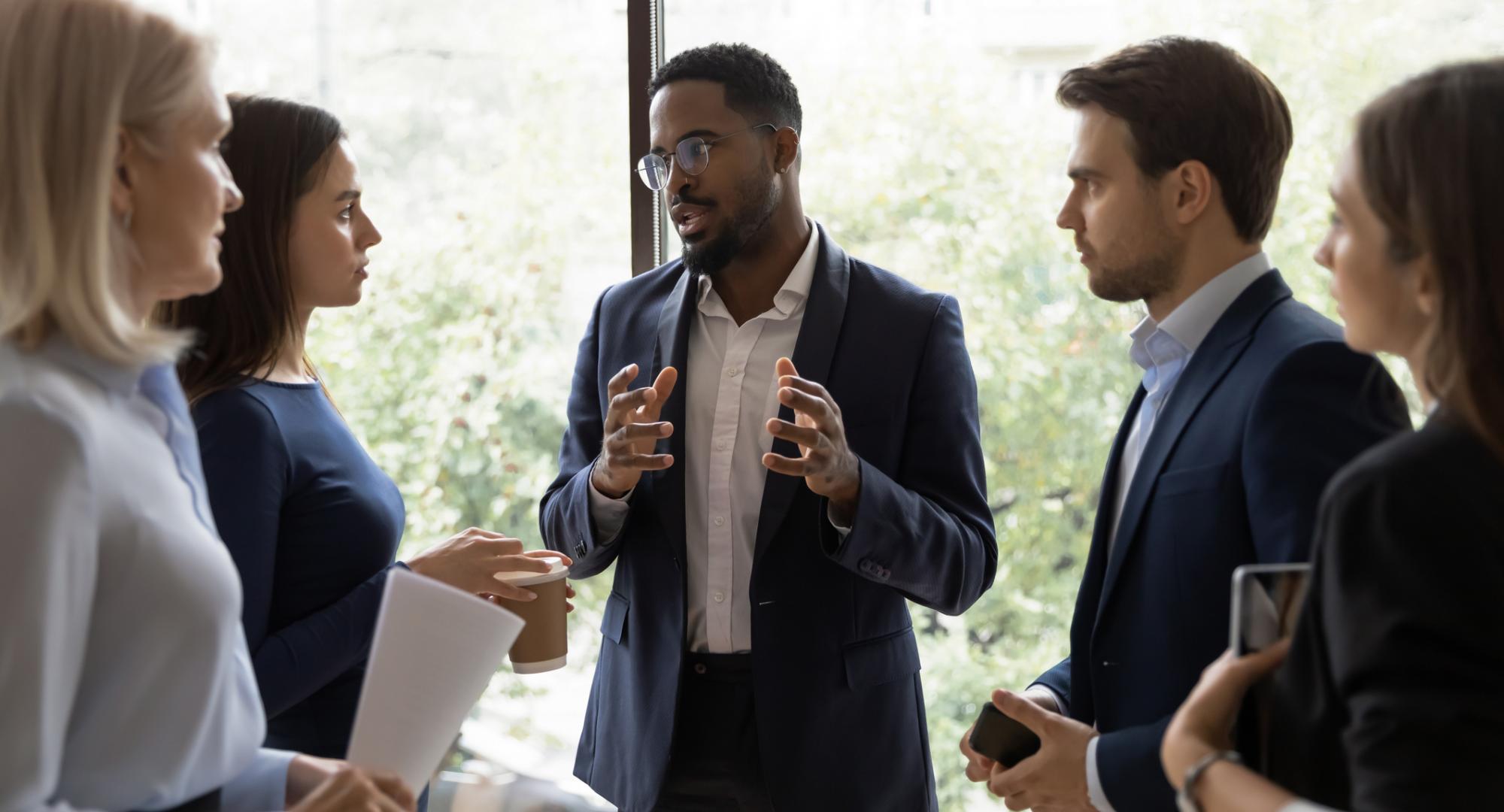 Leader speaking to colleagues