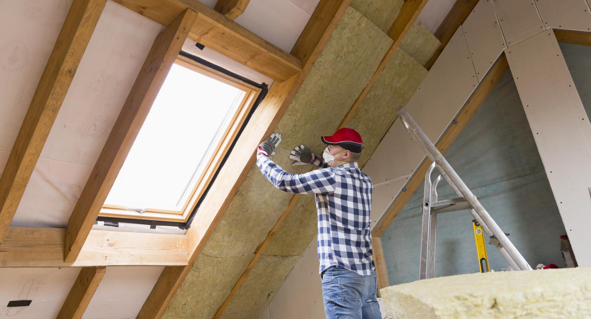 Man insulating house