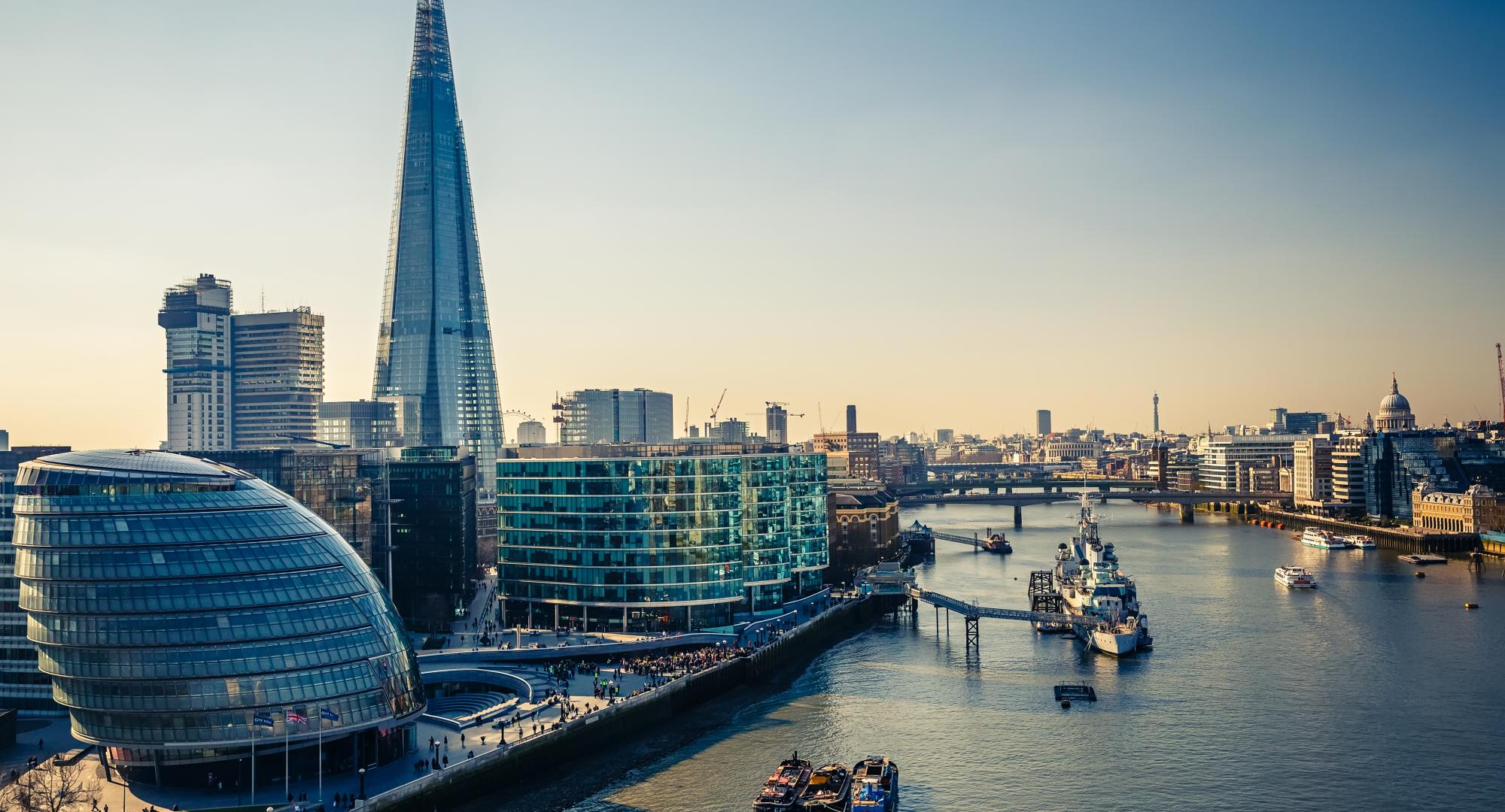 View of London City Hall and skyline at dusk