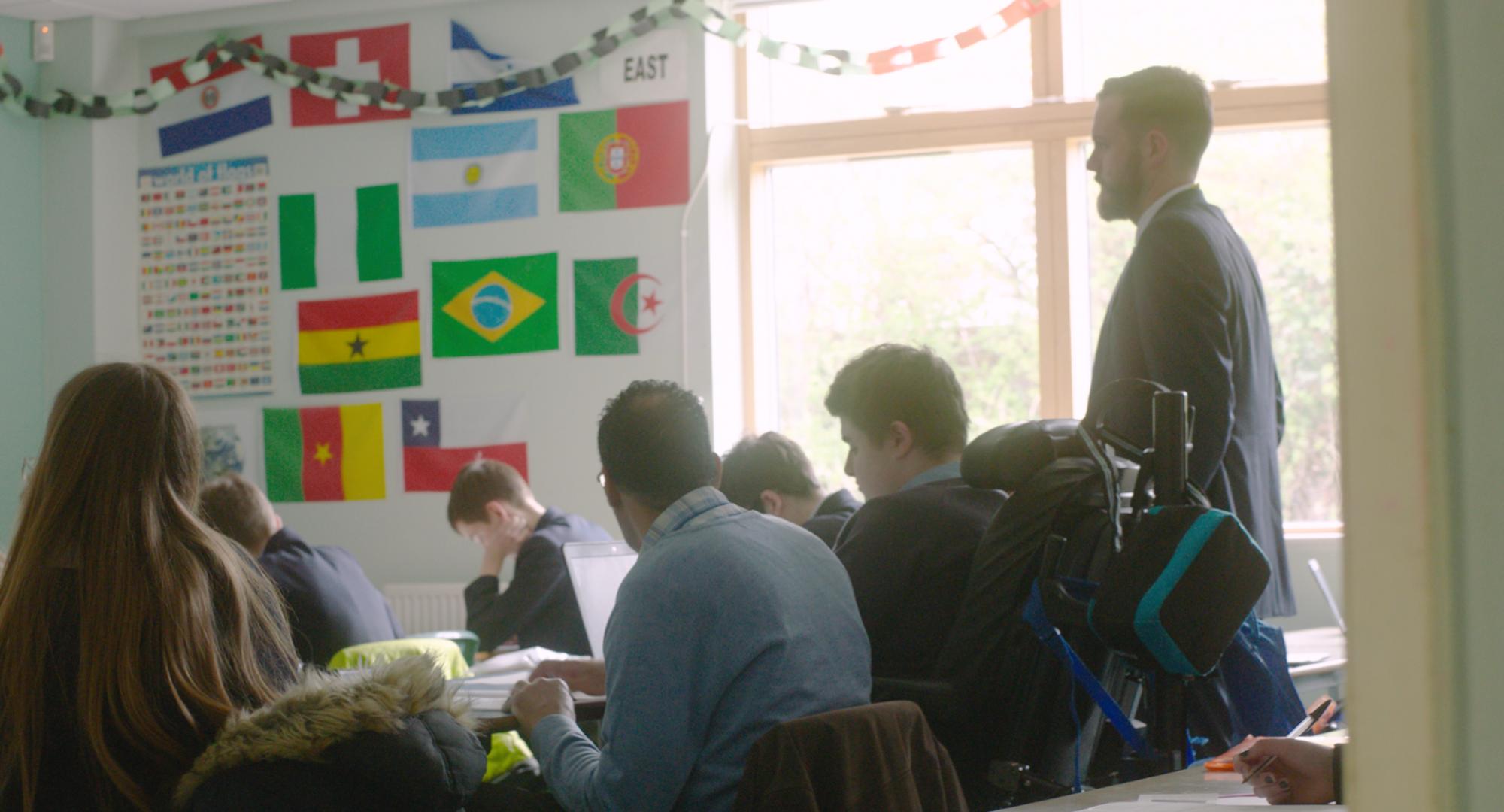 A teacher in a classroom with students