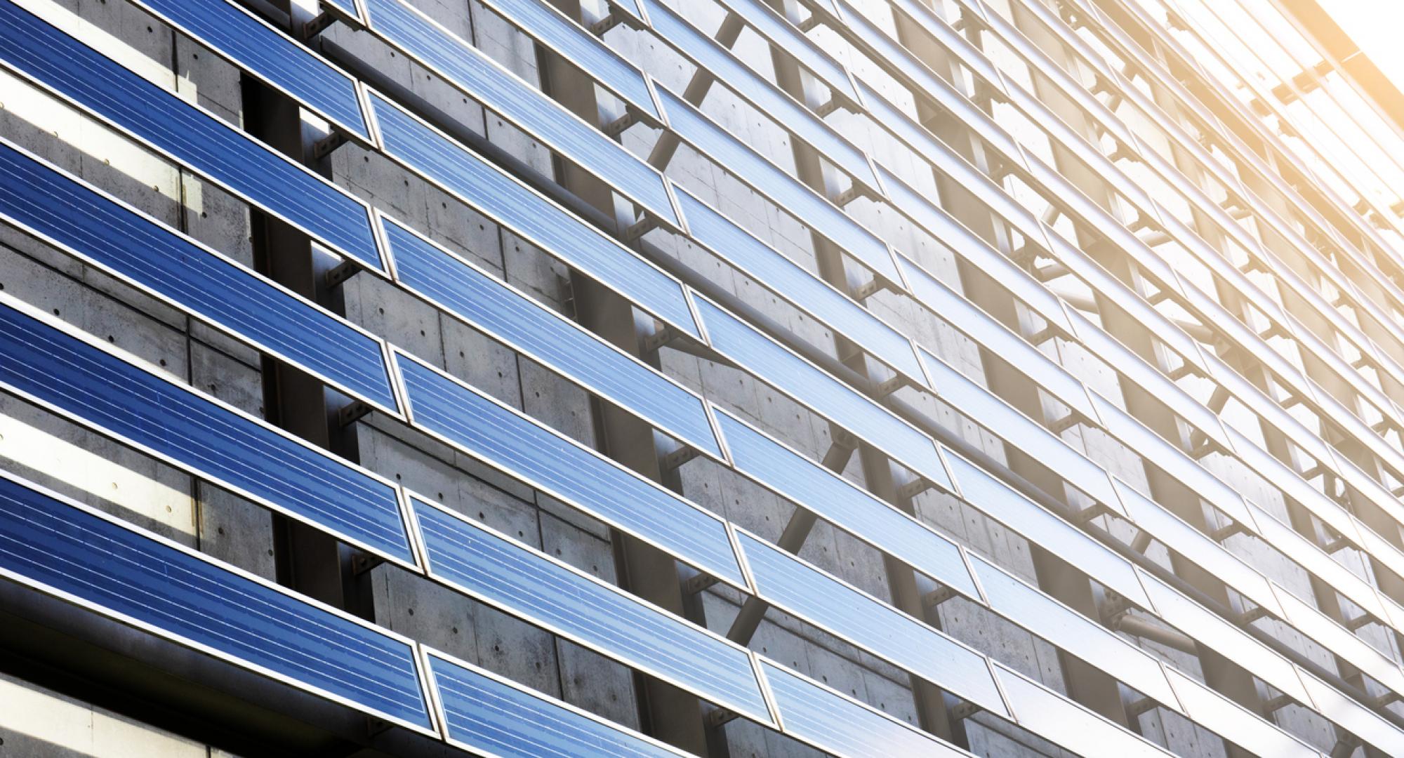 Solar panel on the side of a building on a sunny day