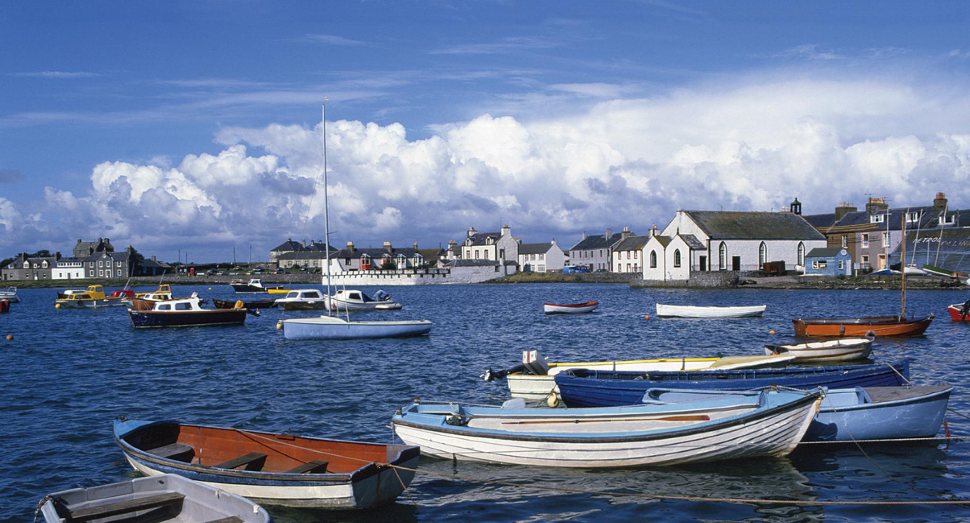 View of boats on the water at Whithorn on a sunny day