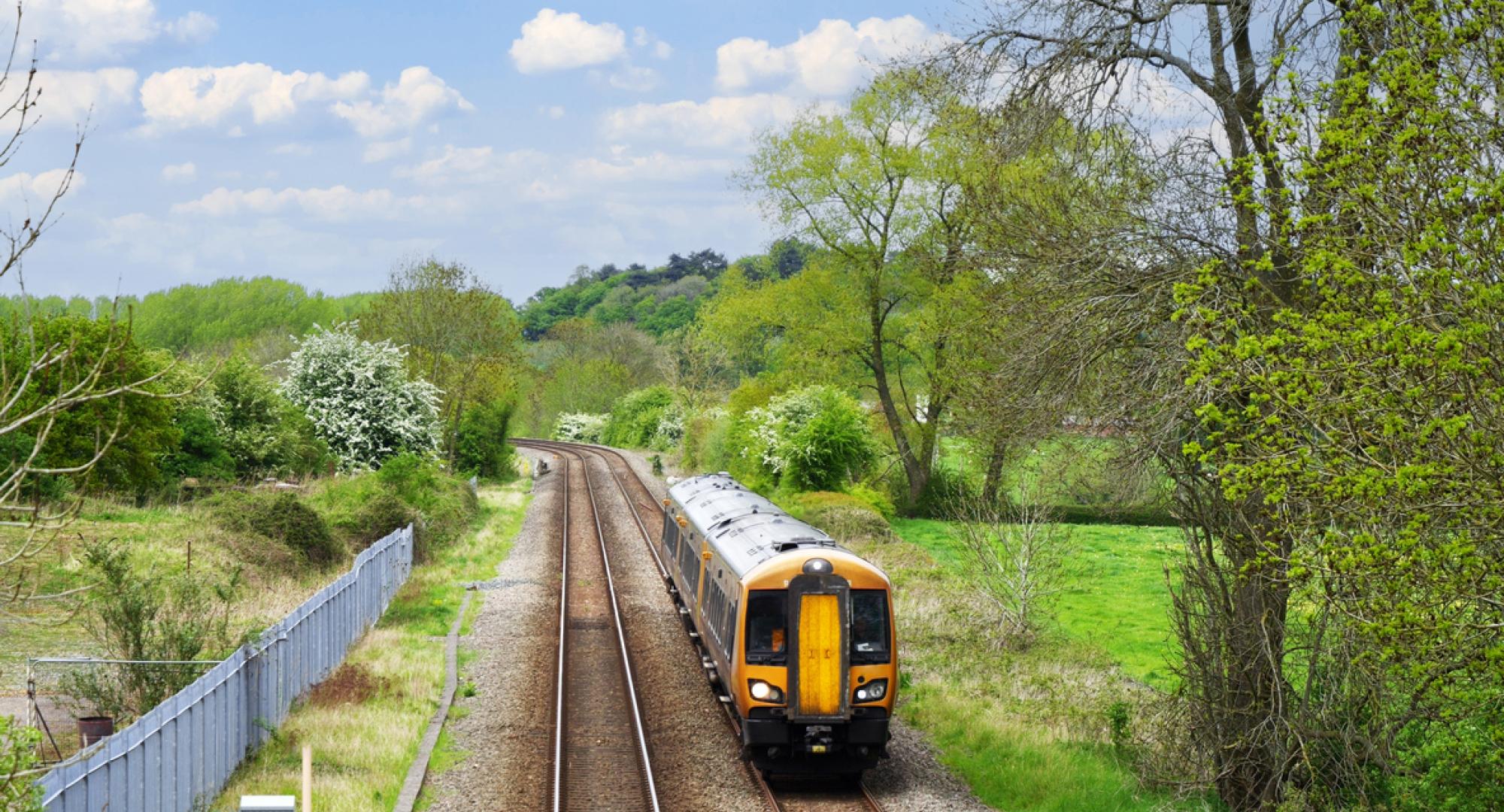 Aerial view of a train on a track in the countryside