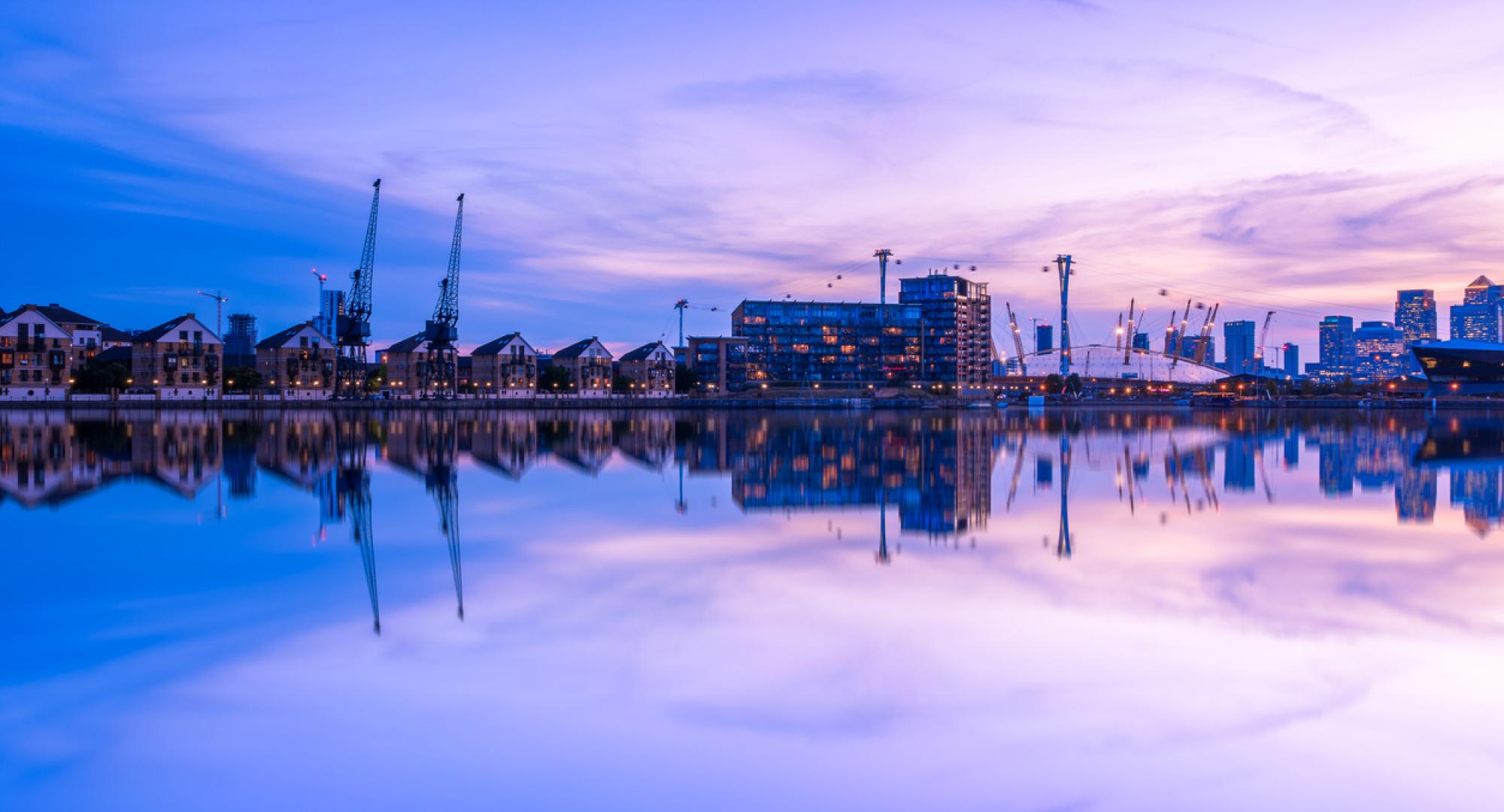 Dusk view of Royal Victoria Dock, with Canary Wharf in the background