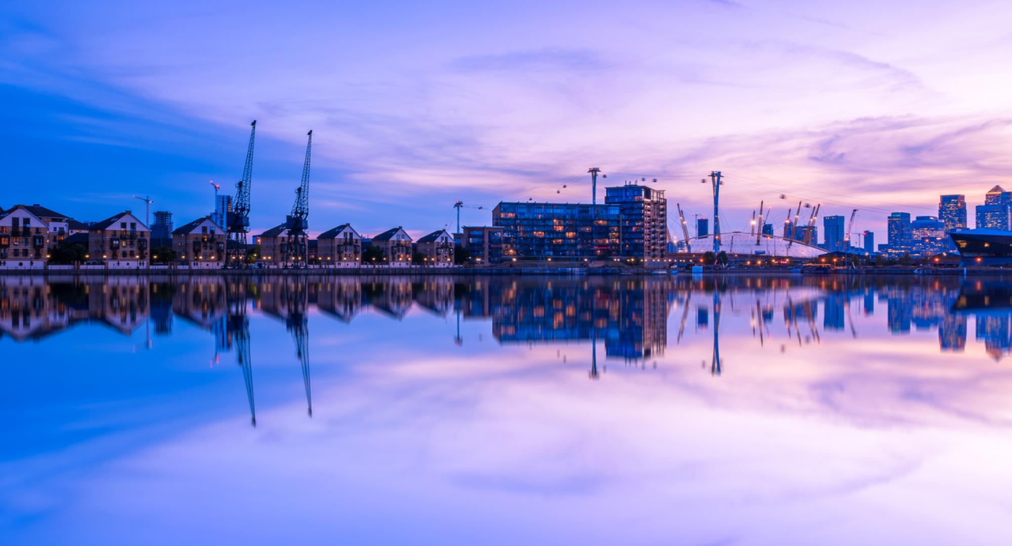 Dusk view of Royal Victoria Dock, with Canary Wharf in the background