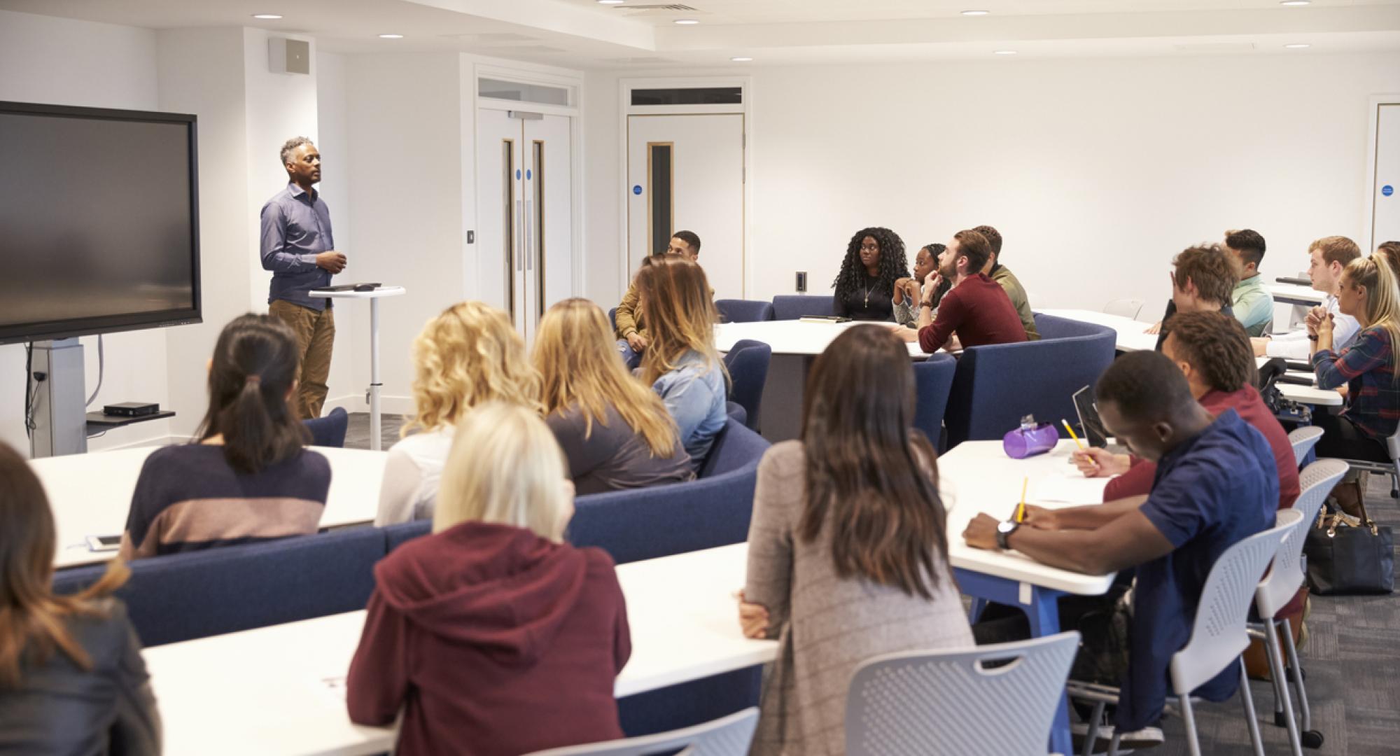 University students in a classroom with lecturer