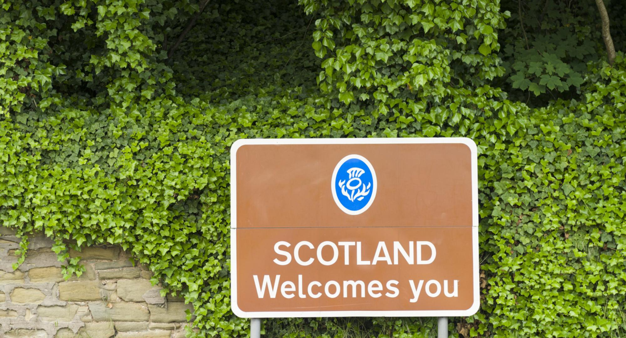Road saying 'Scotland welcomes you'