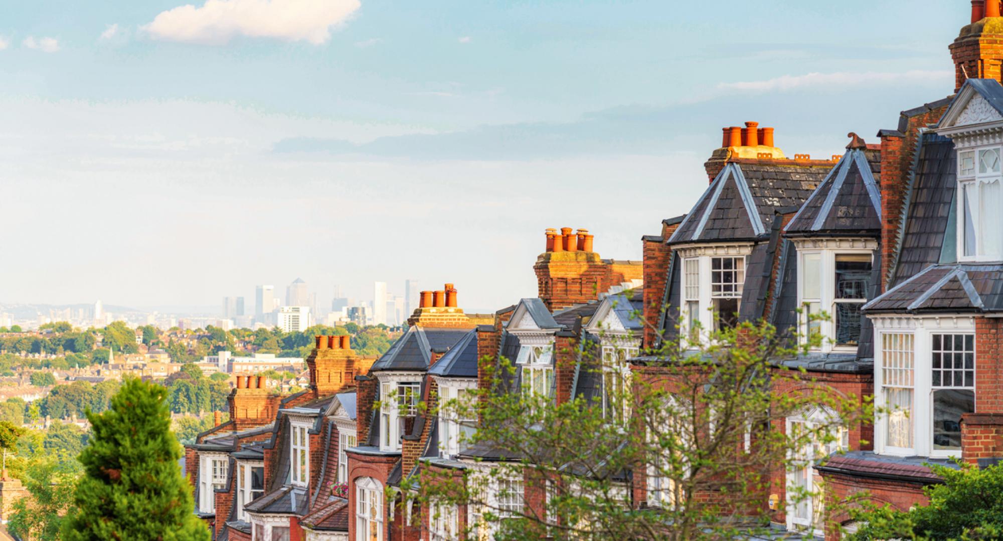 View of houses in London suburb, with Canary Wharf in the background