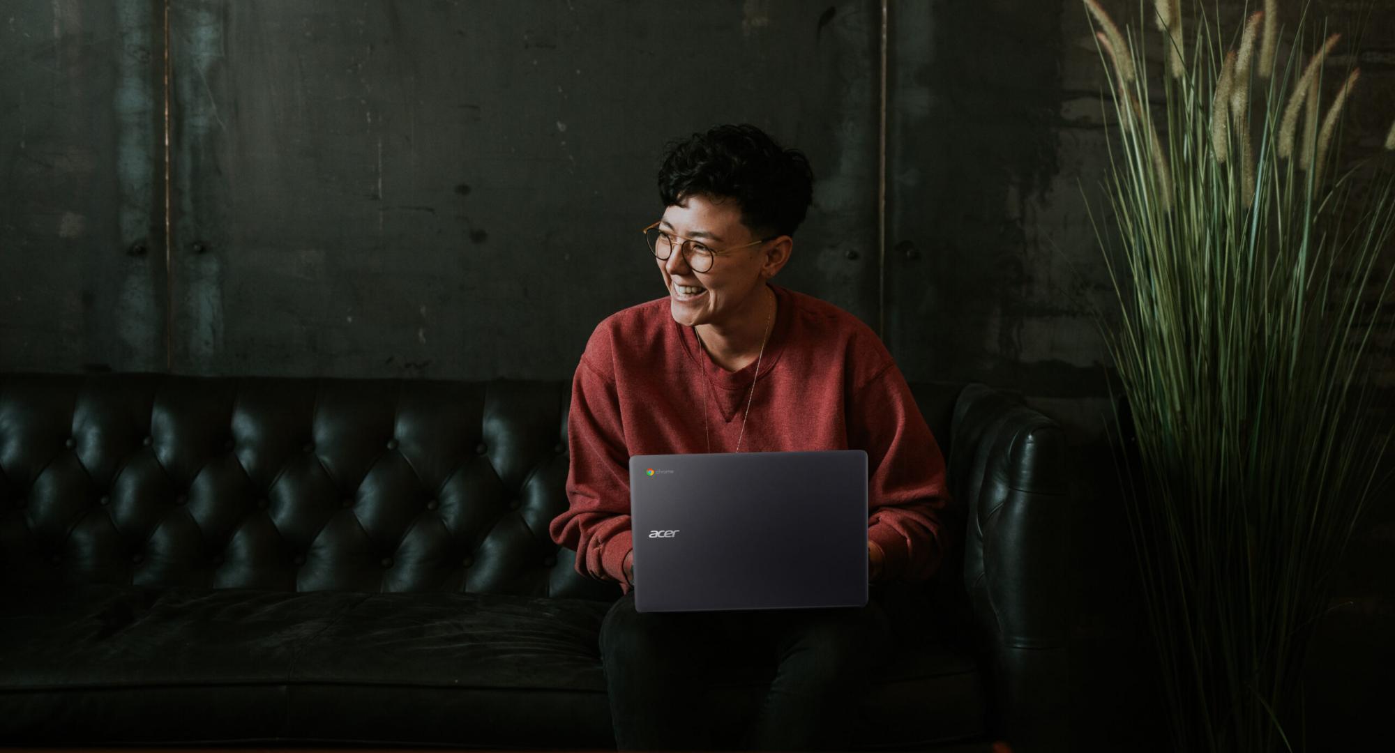 Woman sitting working on a laptop