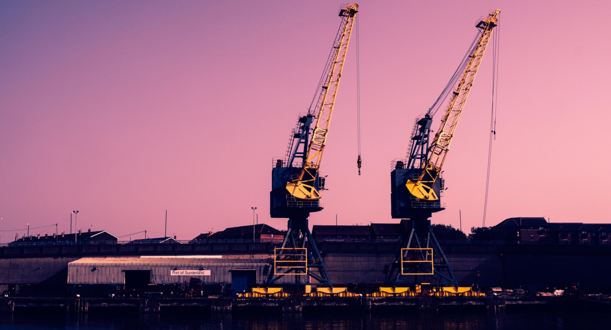 Two tall cranes on the banks of the River Wear in Sunderland, England.