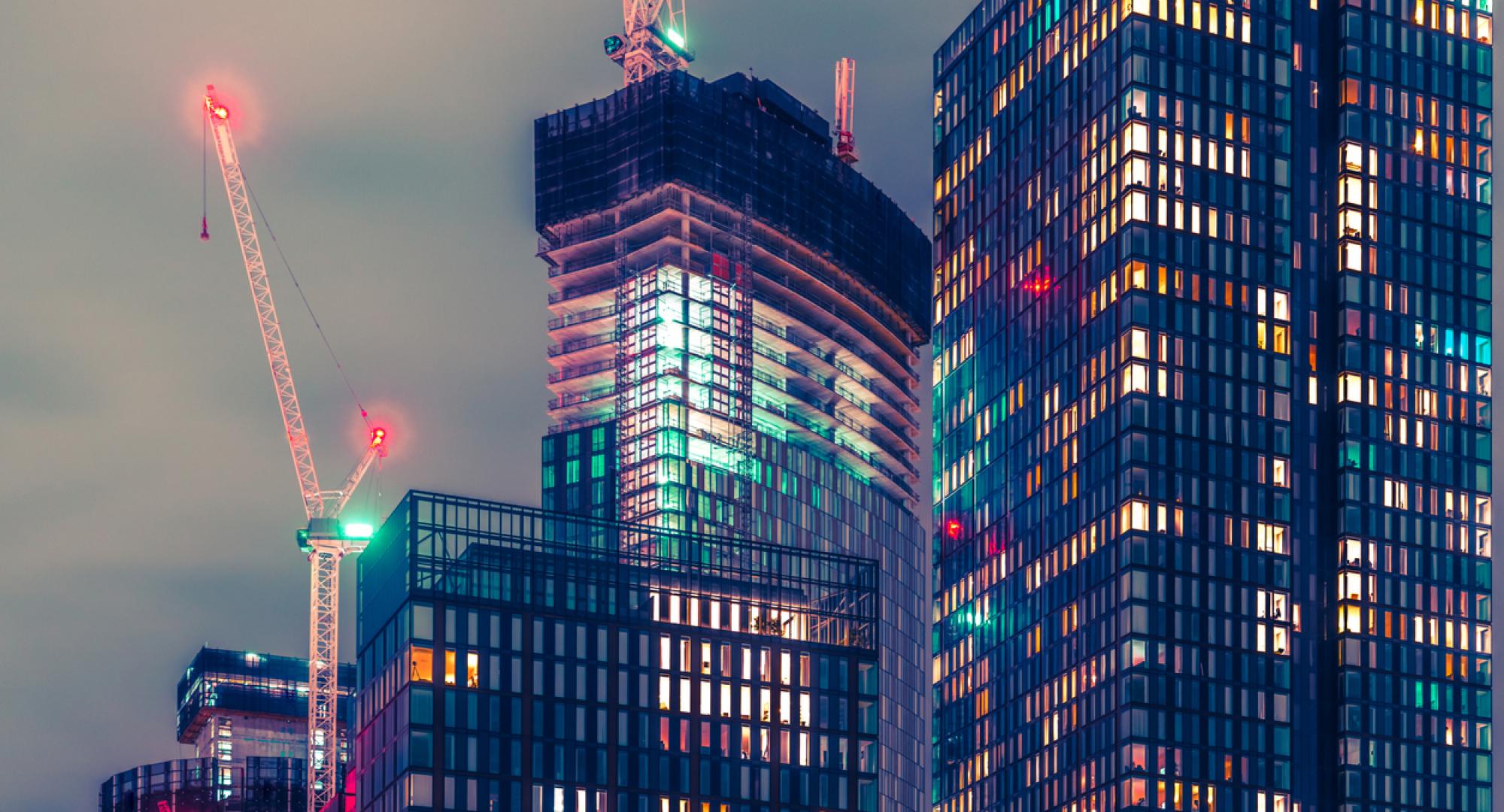 Tall buildings at night in Manchester