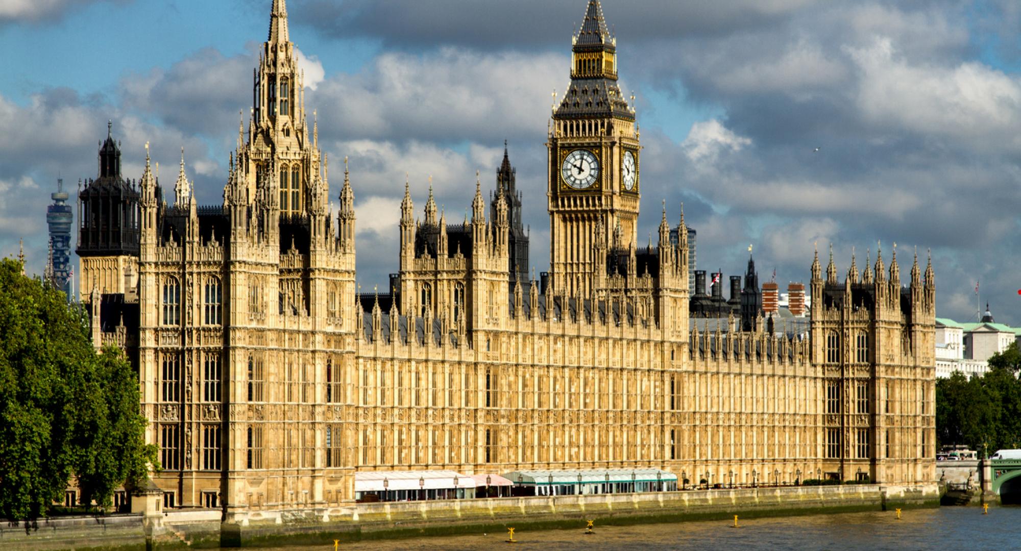 Wide shot of the Houses of Parliament in daylight