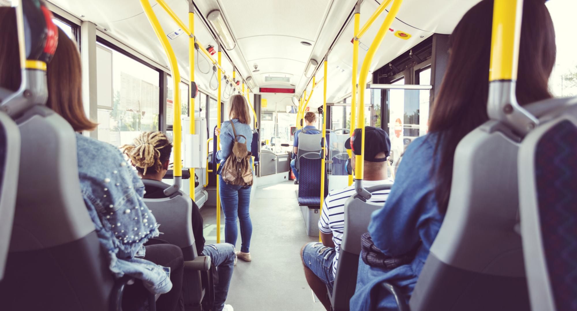 Group of people travelling on a UK bus