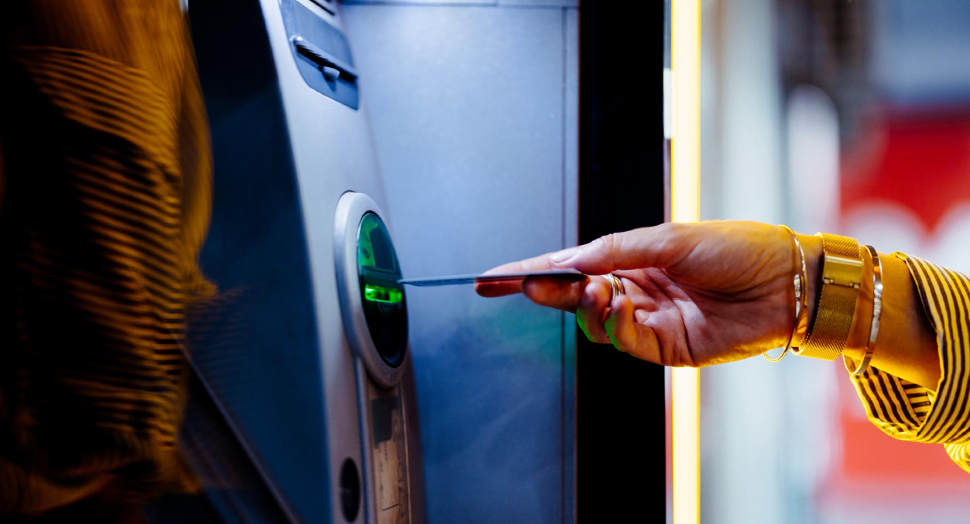 Woman taking cash out of an ATM