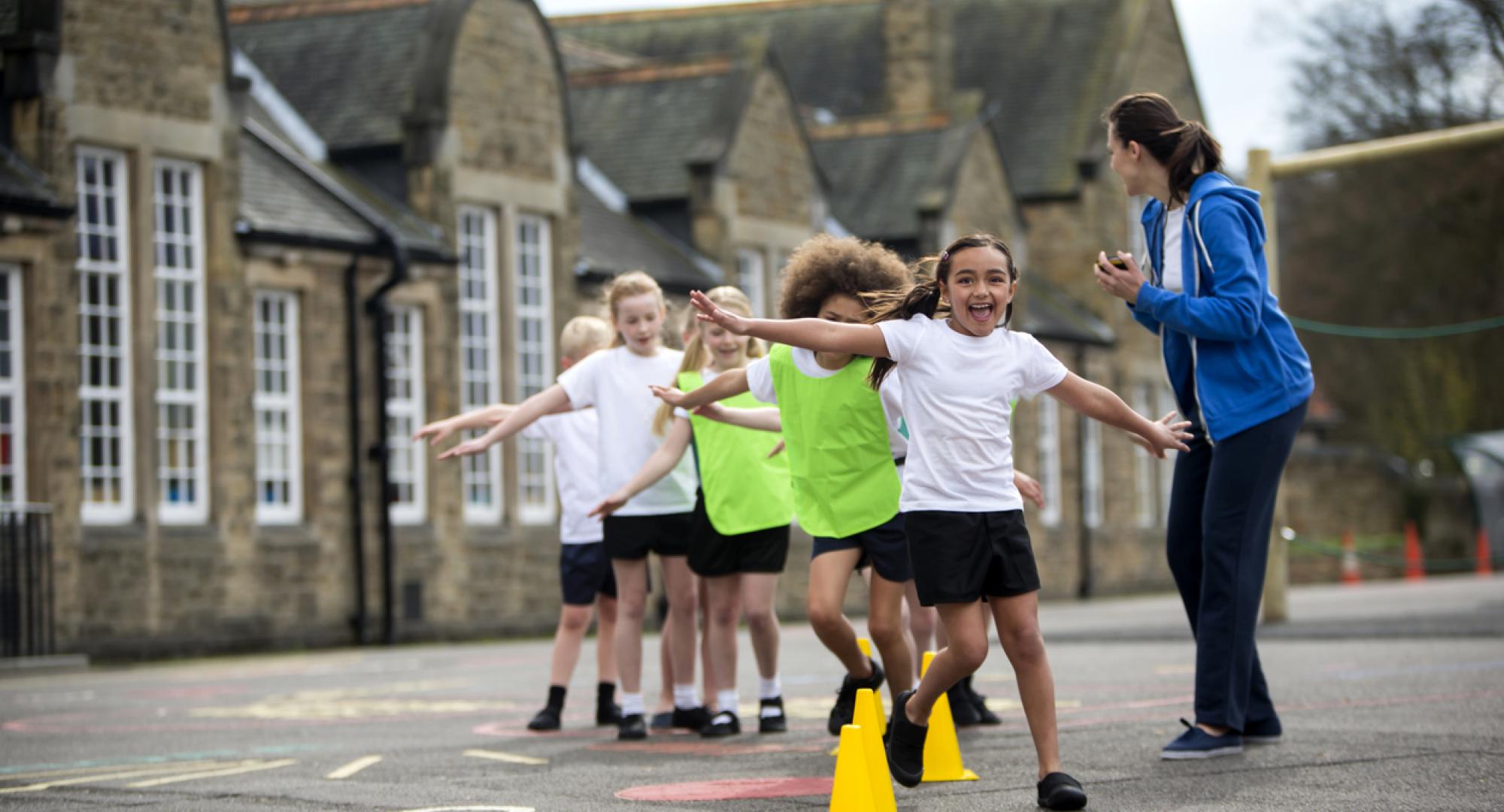 Children doing physical education in a school playground