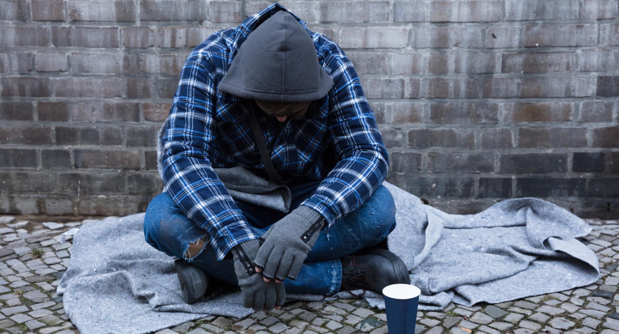 Beggar Sitting On Street stock photo