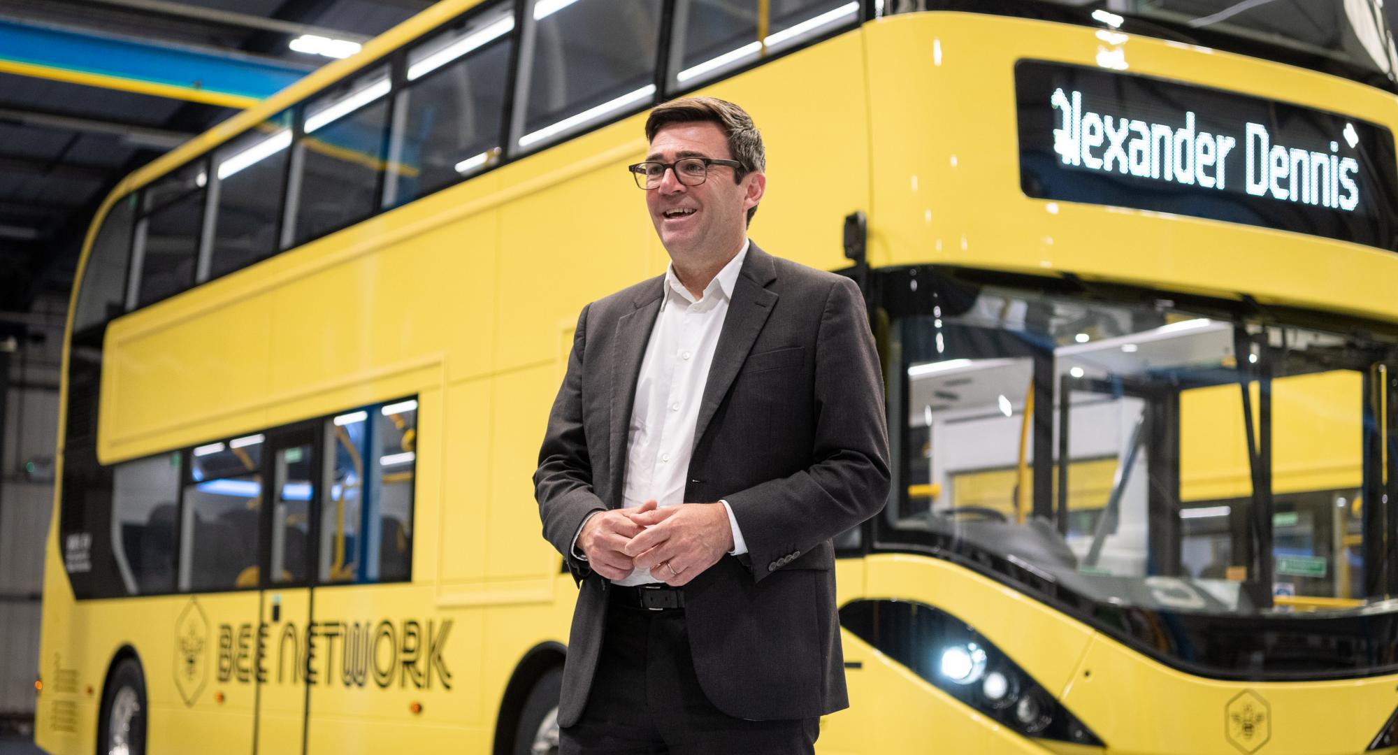 Andy Burnham with one of the buses