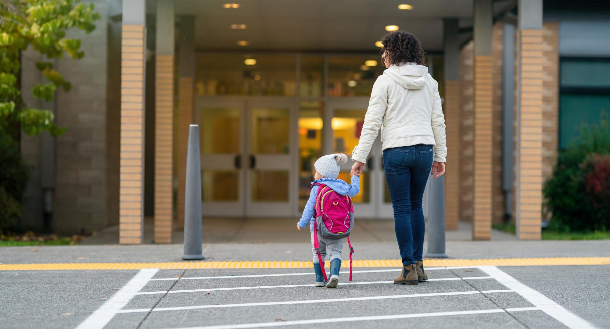 Woman walking with child