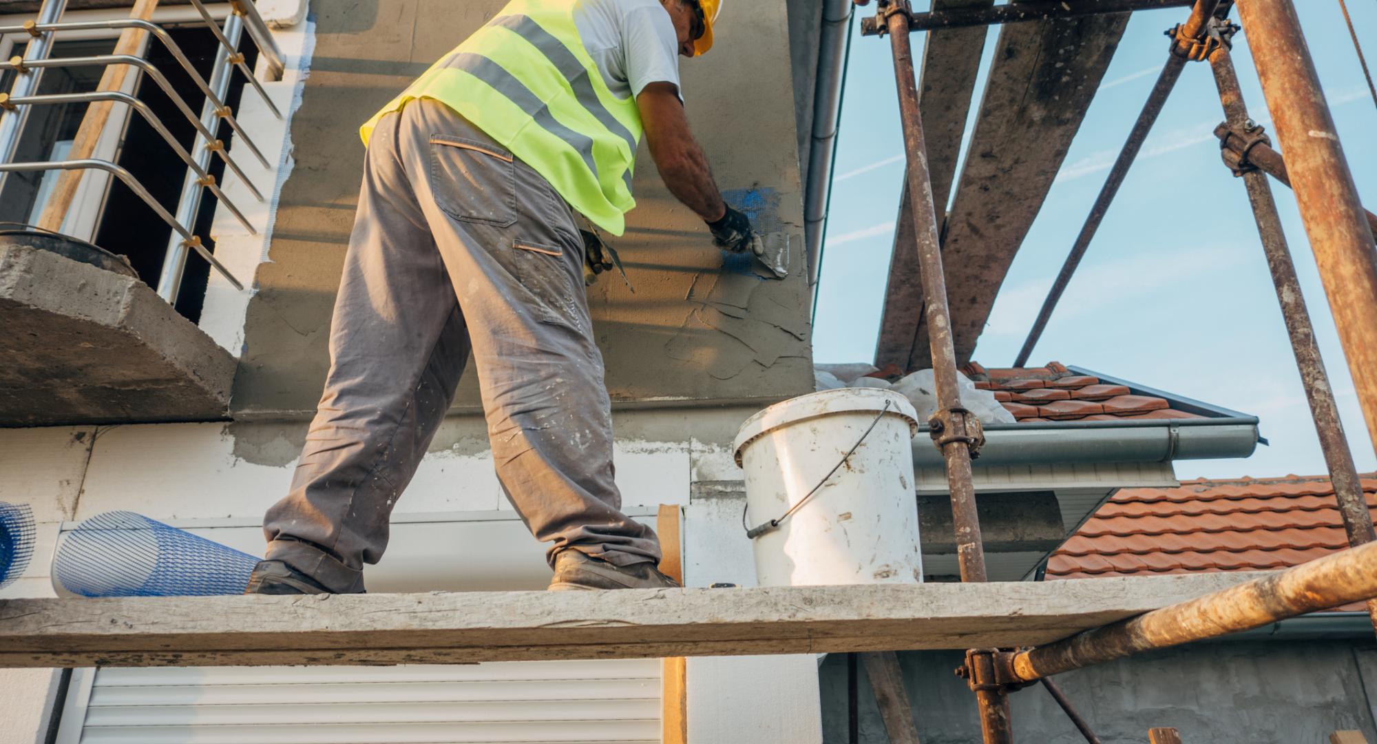 Man building an affordable house in West Sussex