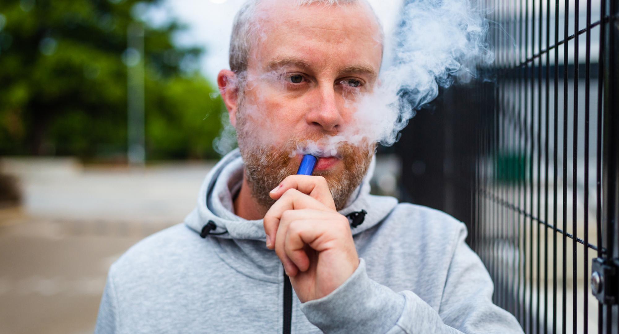 Man using a disposable vape