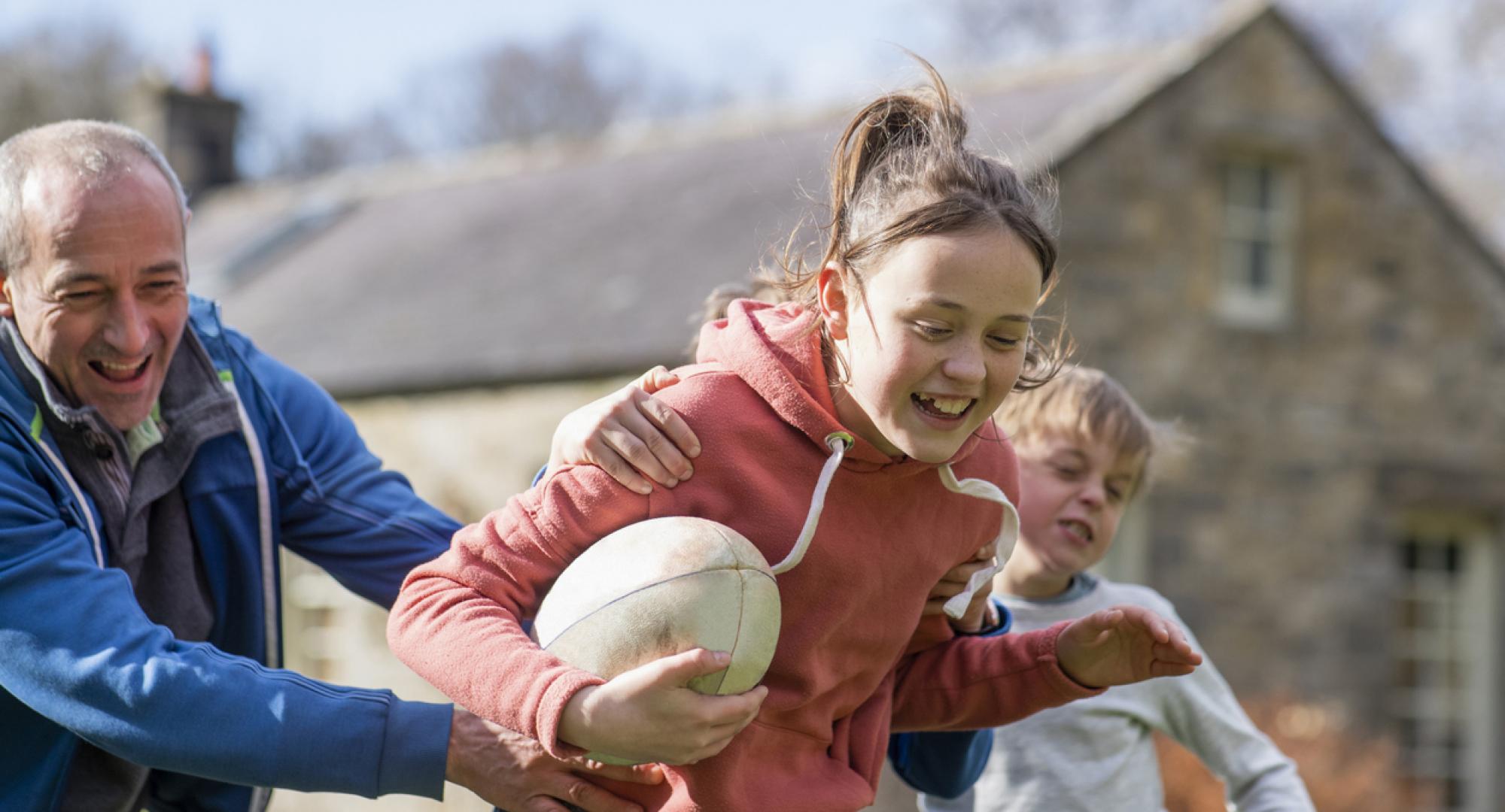 Kids playing rugby during the summer holidays