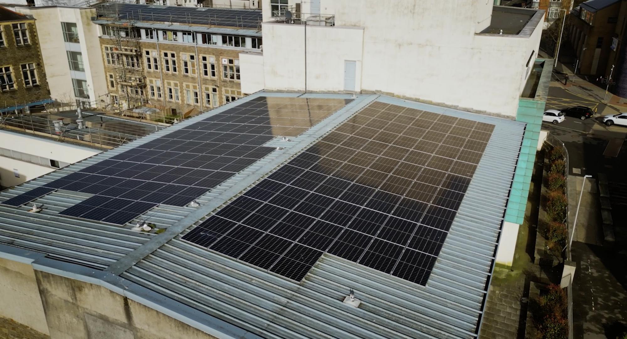 Image of some EDF solar panels on the roof of a university building