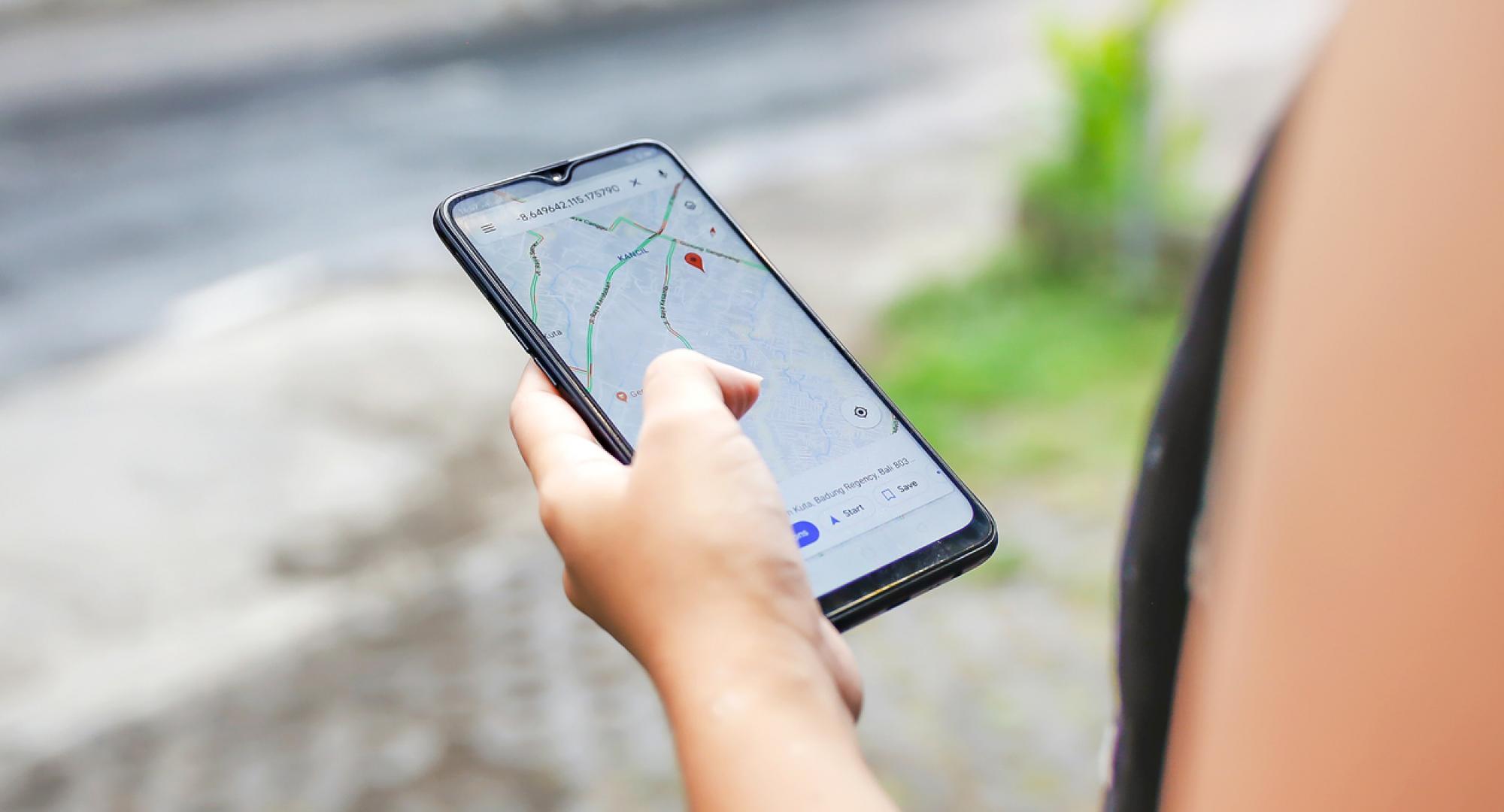 Woman using google maps to plan her journey