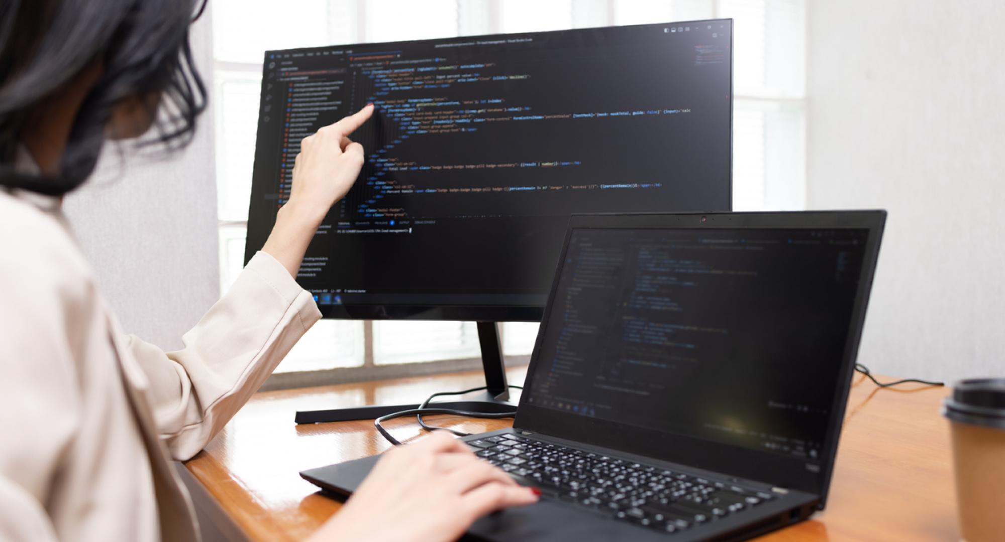 Woman working on cyber security on a computer