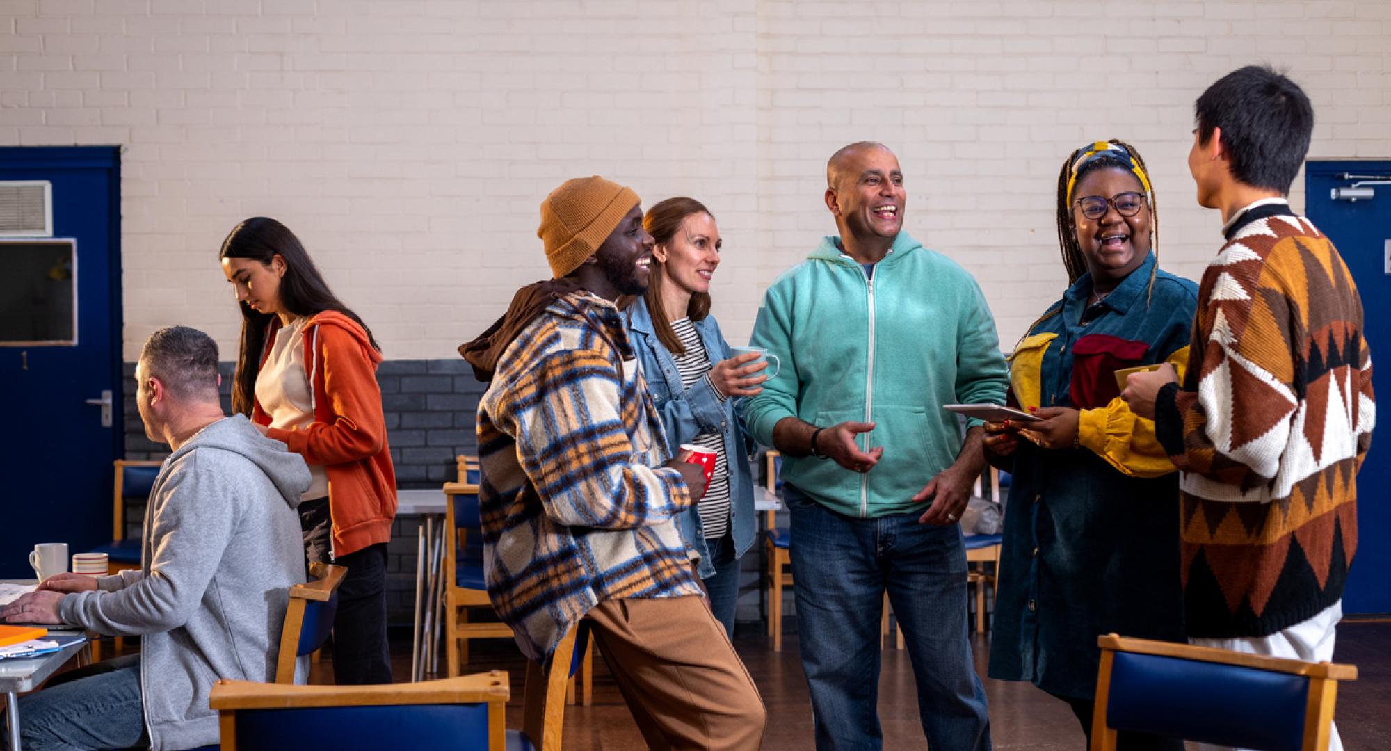 People socialising in a community centre in England