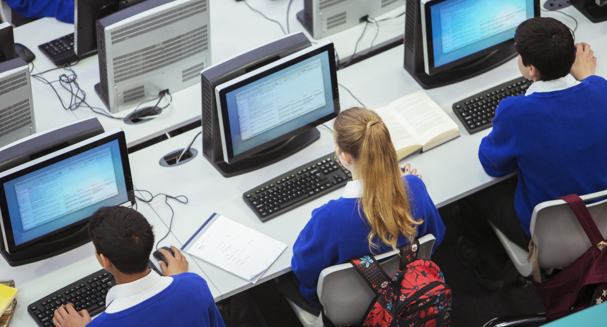 Pupils sat working on computers in a classroom