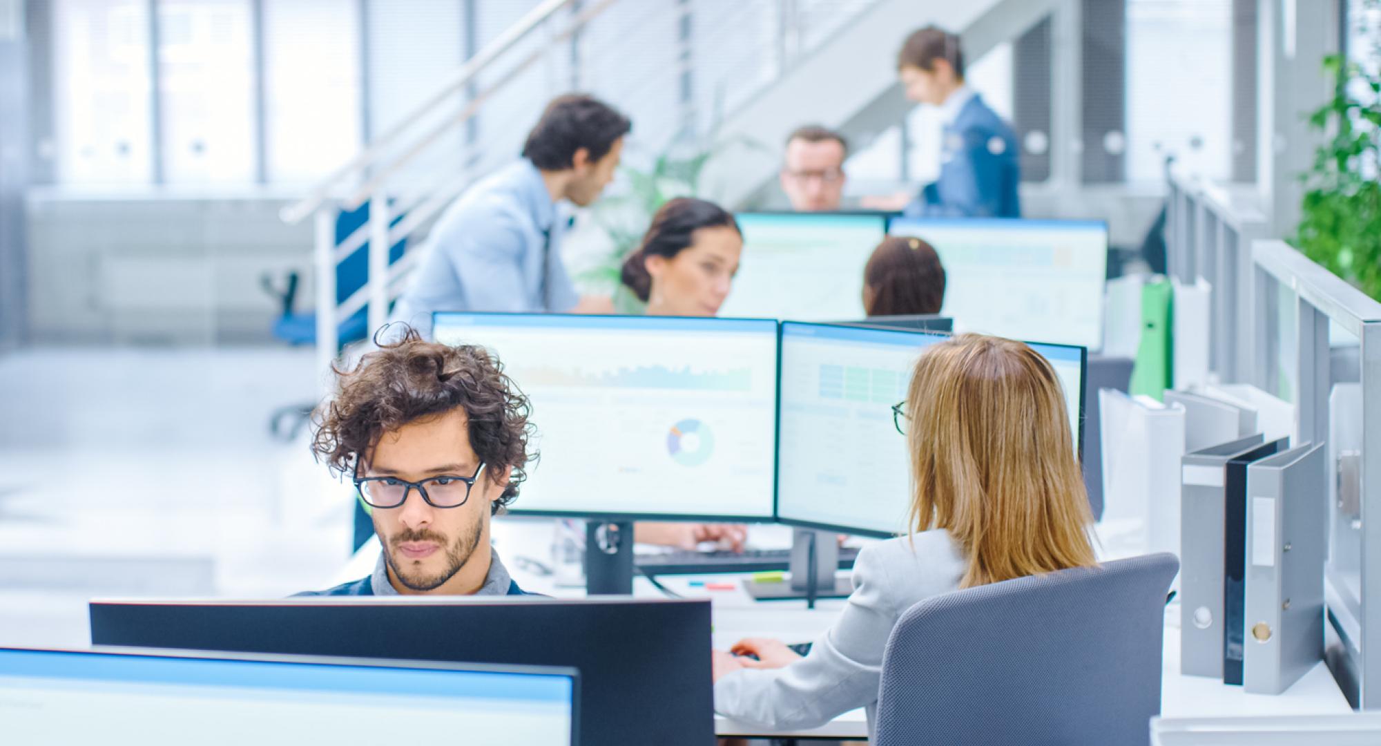 Big Busy Corporate Office with Two Rows off Businessmen and Businesswomen