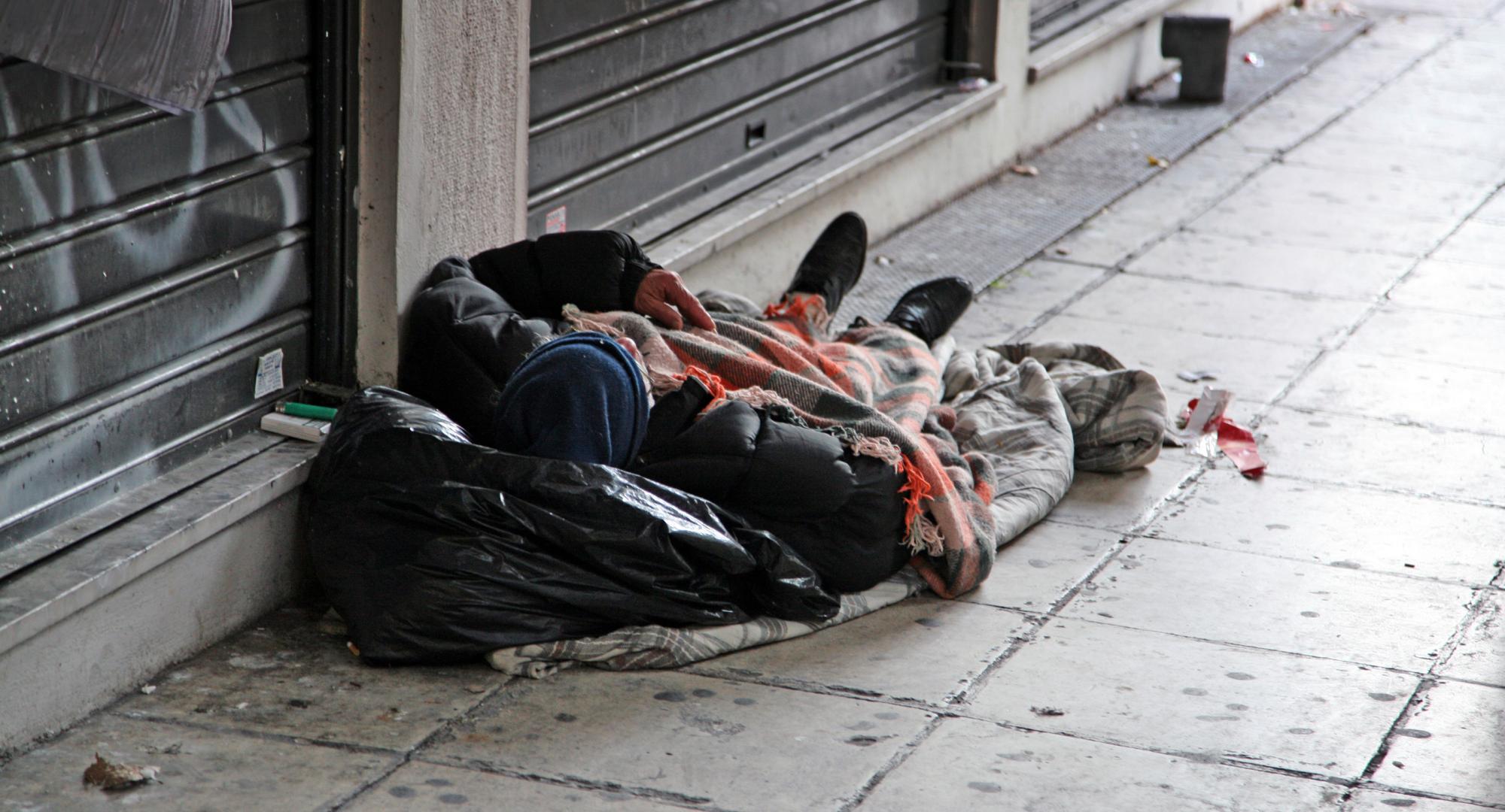 Homeless man sleeping on the street