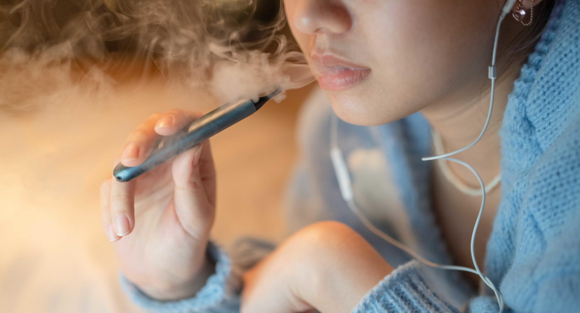 Woman smoking electronic cigarette