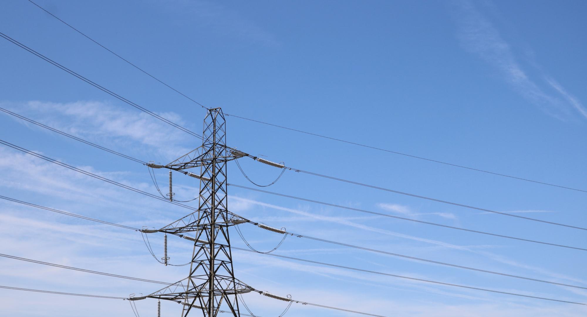 Broadband pylon against soft blue cloudy sky