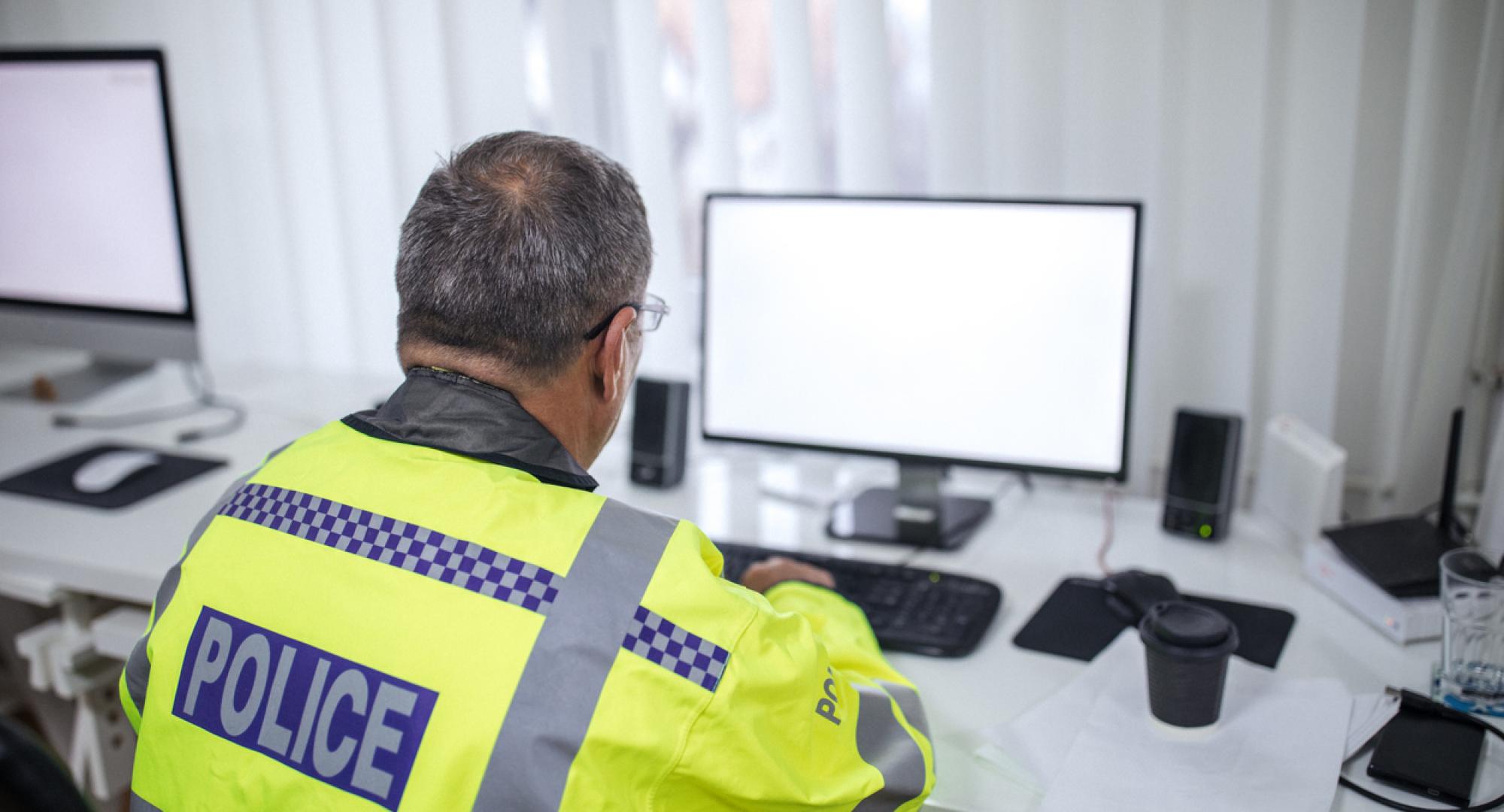 Police officer writing a report