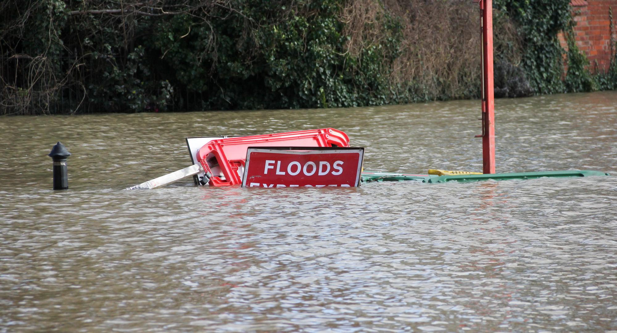 Road closed Flood signs underwater as floods have risen over them in Shrewsbury Shropshire during floods in February 2020