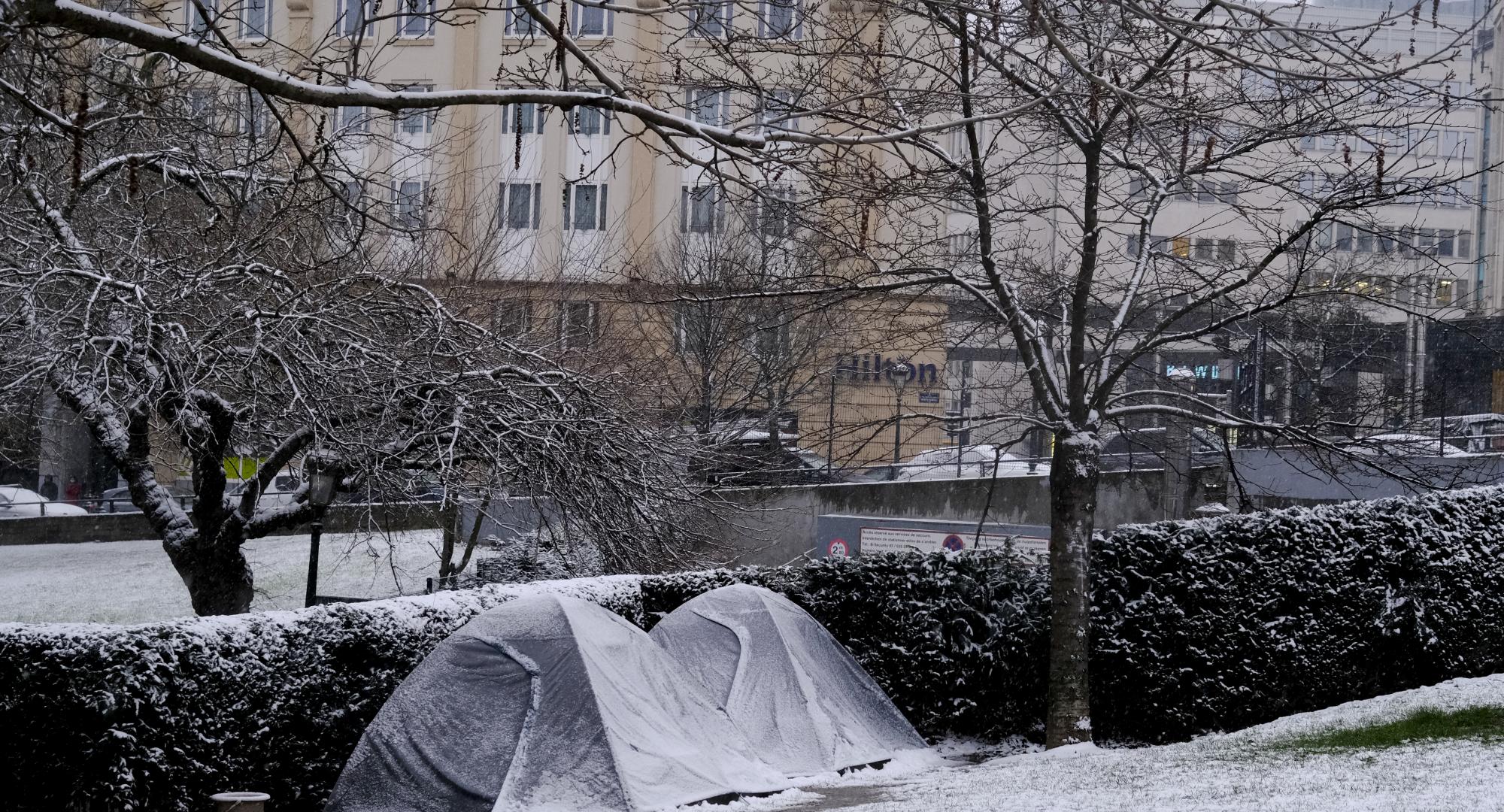Tents of homeless people as seen in park during a heavy snowfall