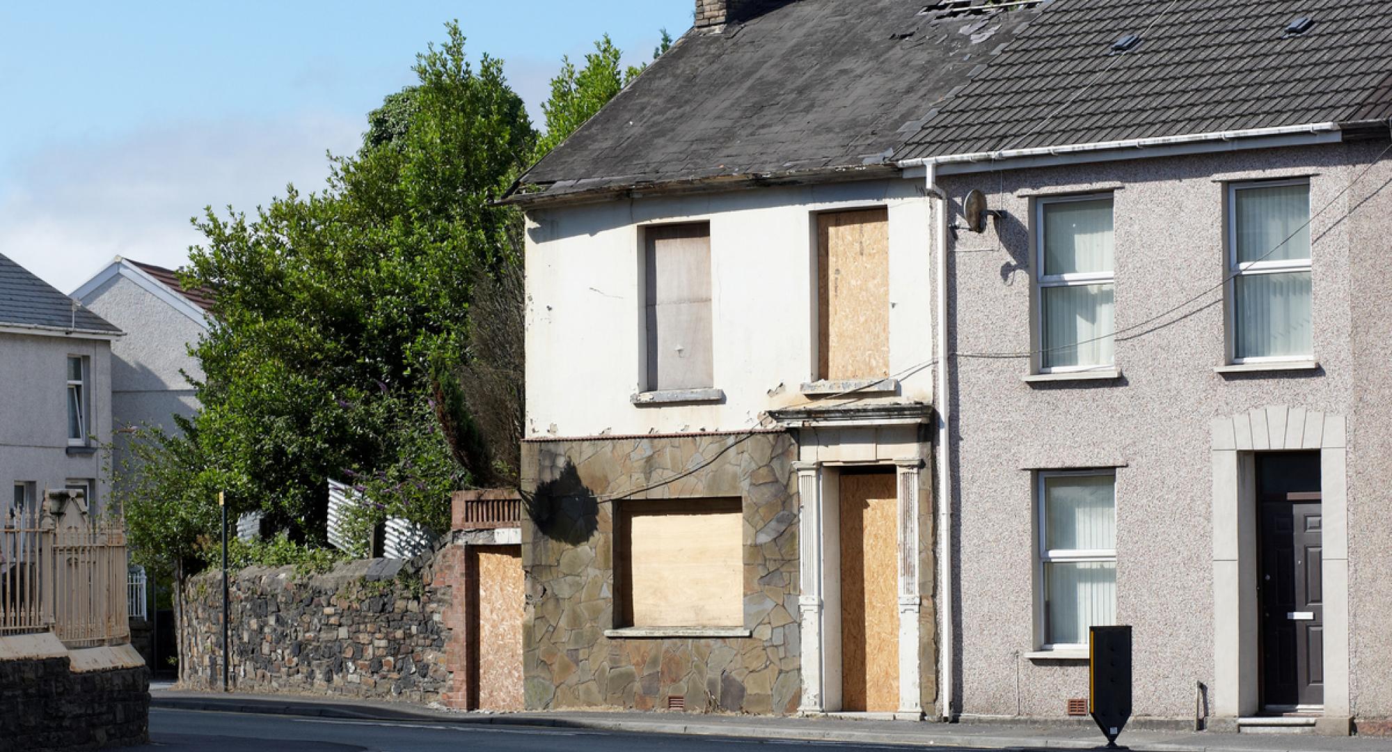 Typical UK terraced housing street derelict