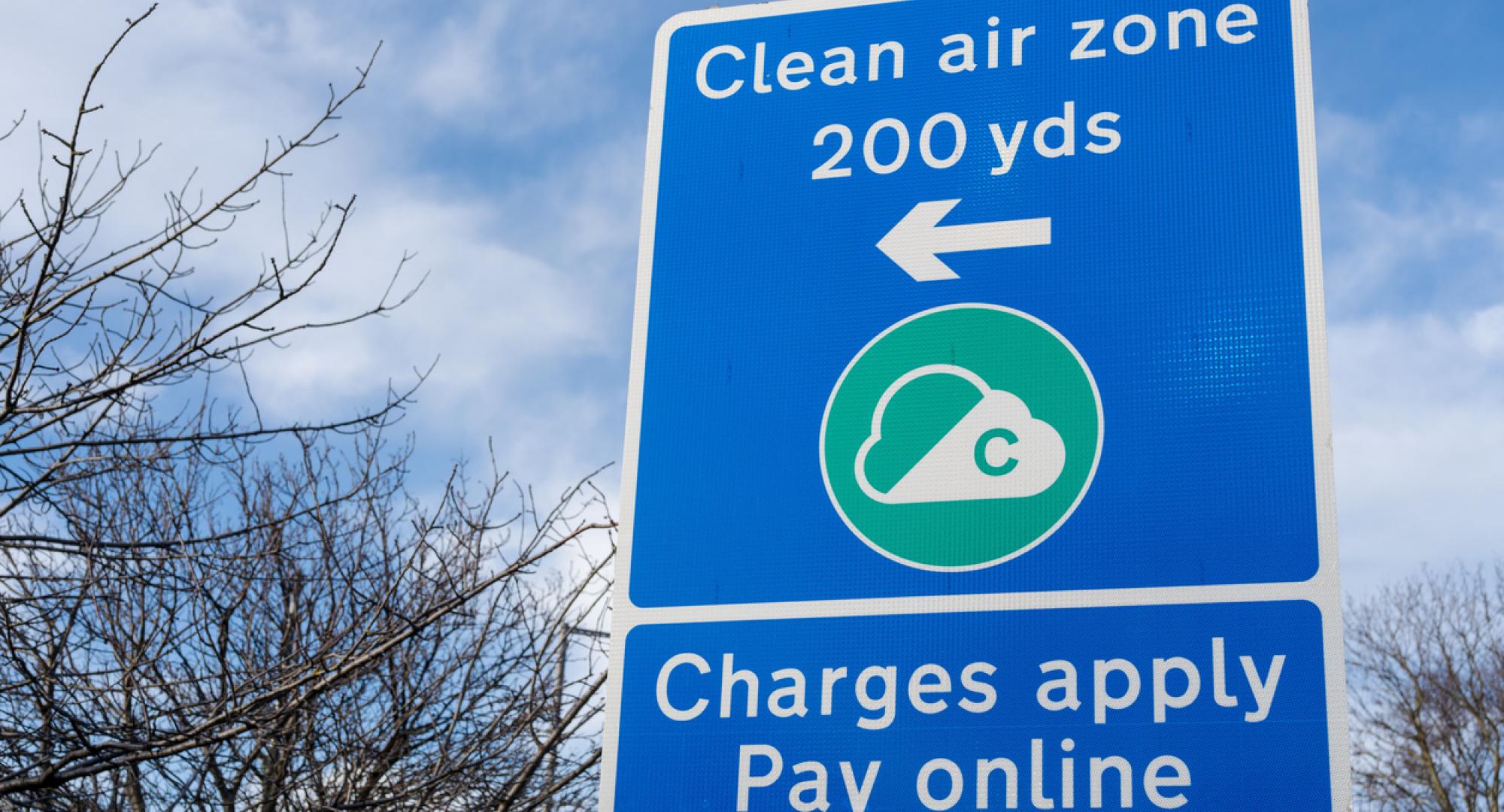 A sign indicates Clean Air Zone (CAZ) charges