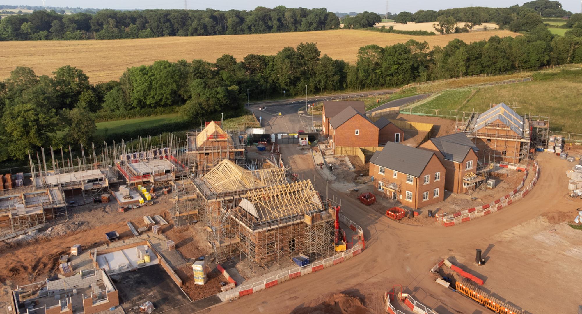 Aerial view looking down on new build housing construction site in England
