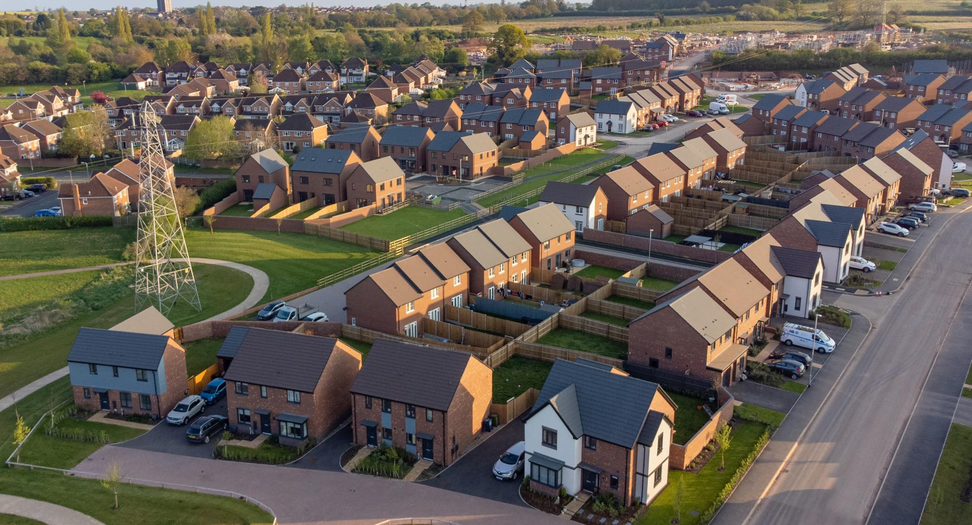 Aerial view of new build housing construction site in England