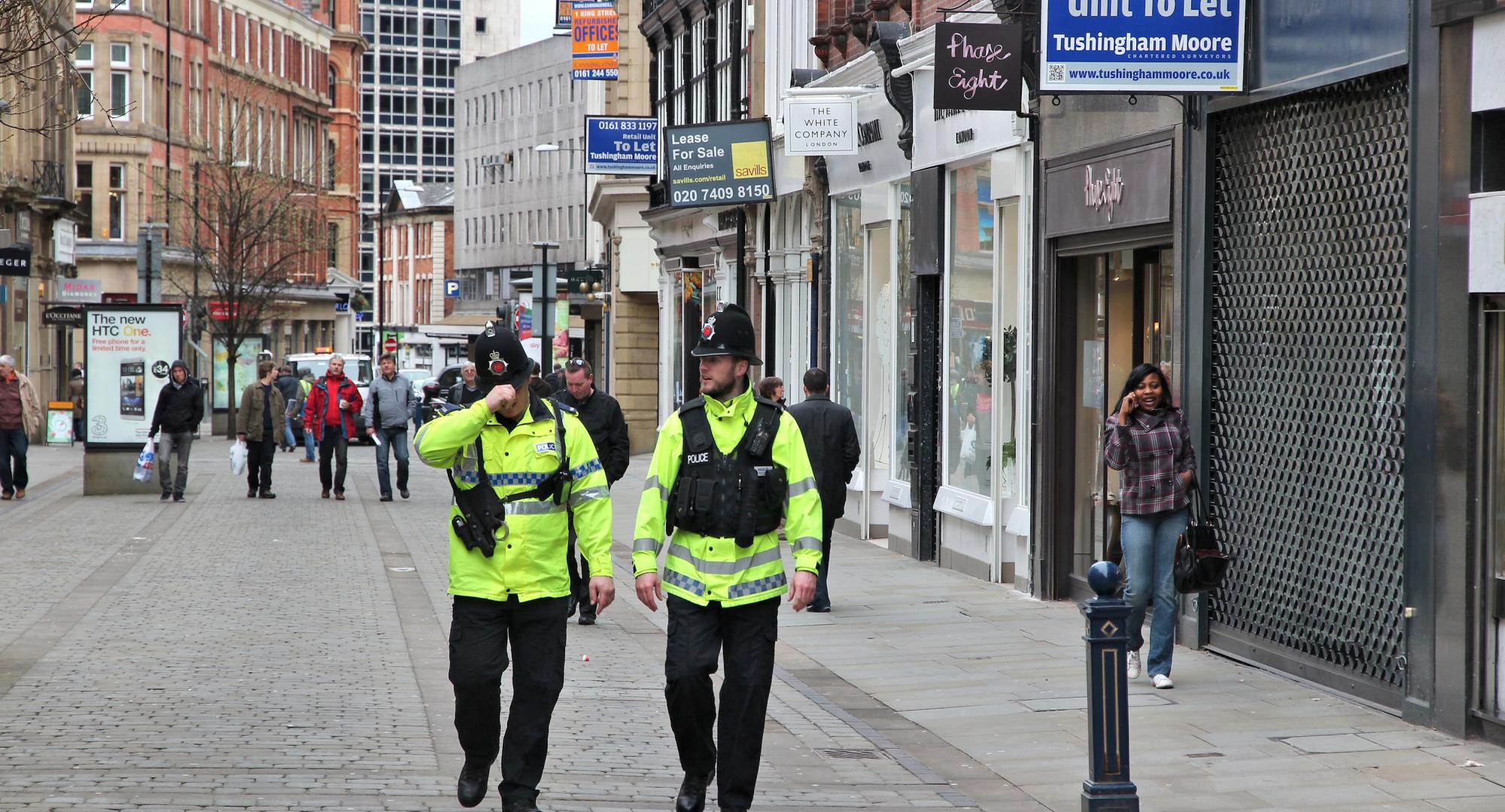 Police officers patrolling streets of Manchester, UK