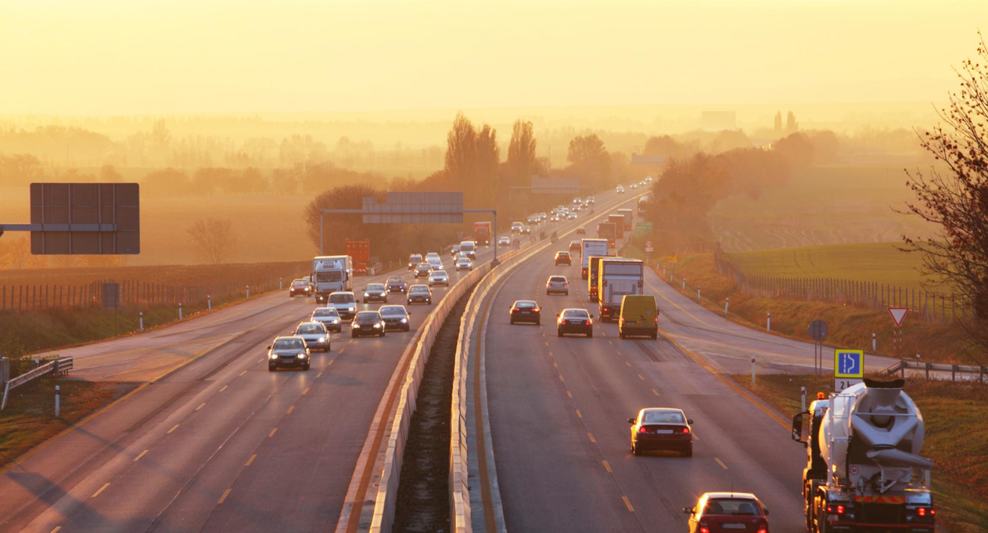 Traffic on highway with cars.