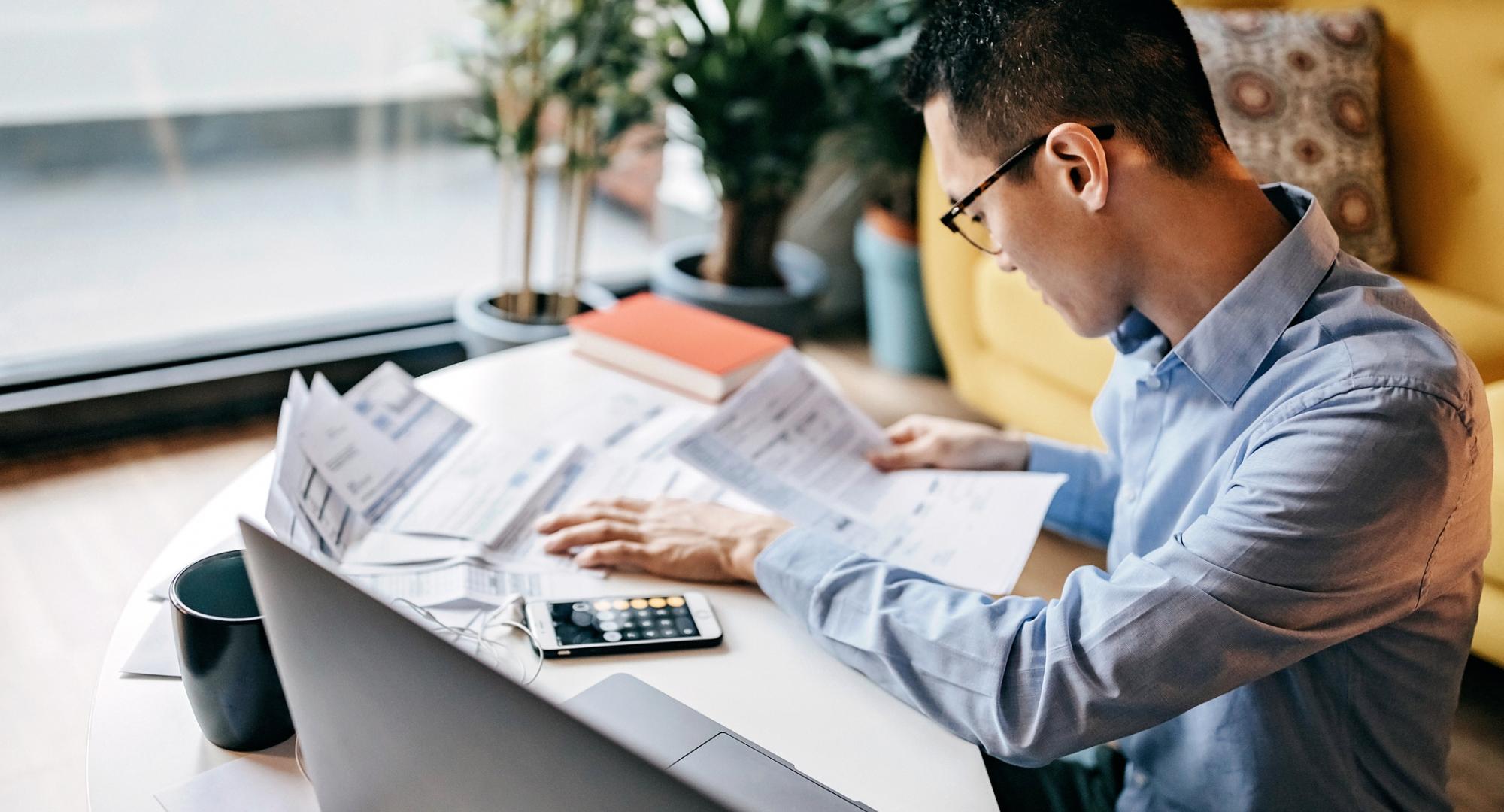 man calculating financial bills