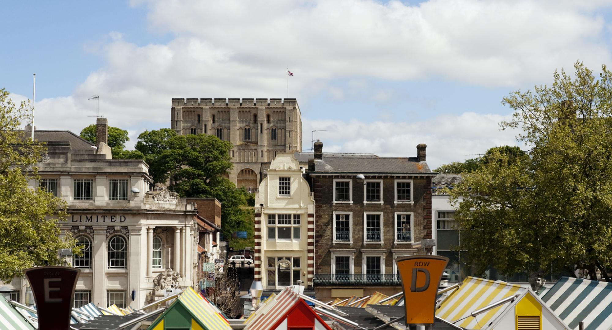 The famous market in the centre of Norwich, with Norwich Castle behind.