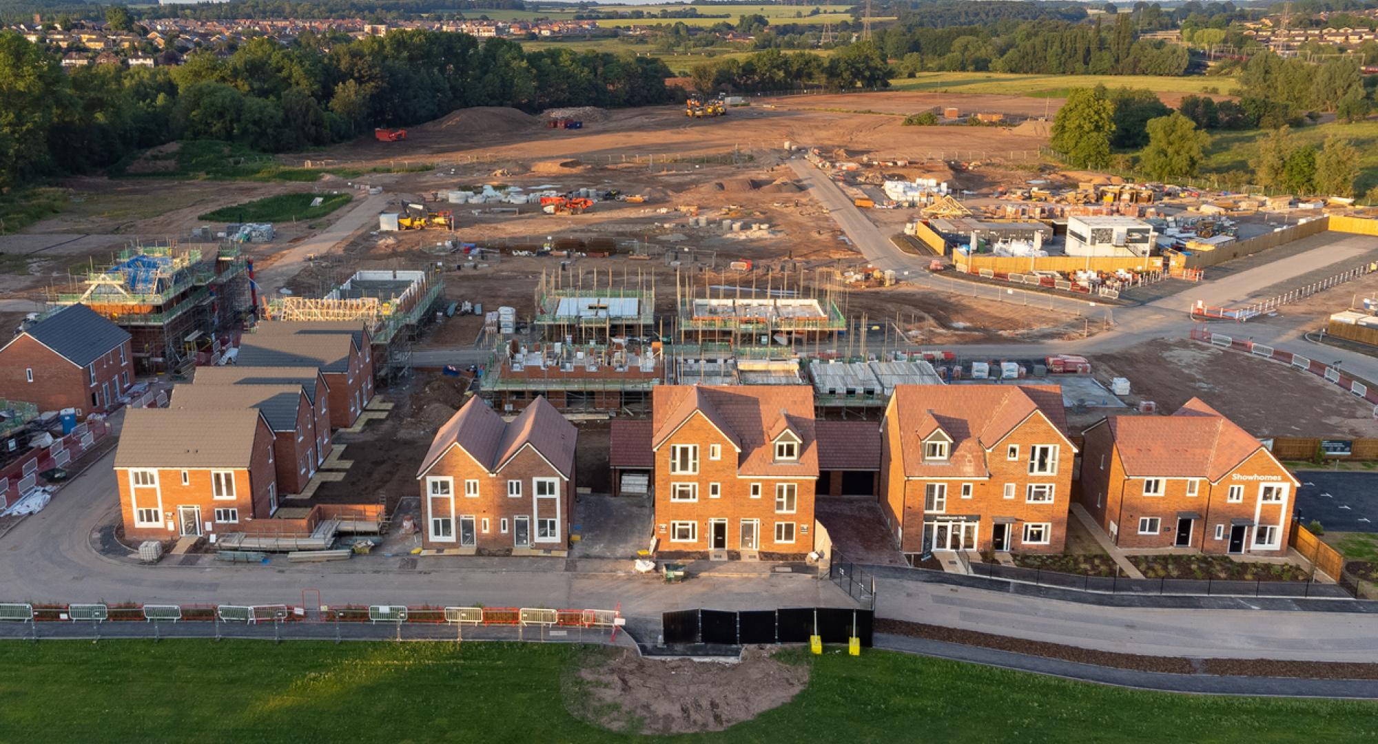 Aerial view looking down on new build housing construction site in England, UK