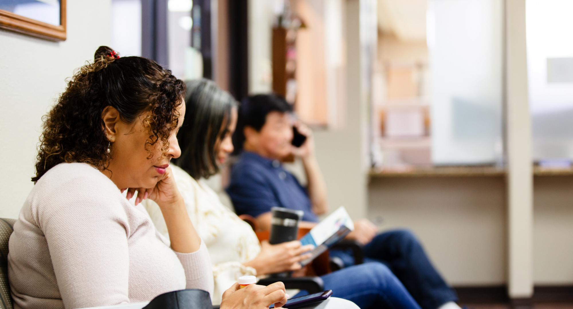 People sit in doctor's waiting room